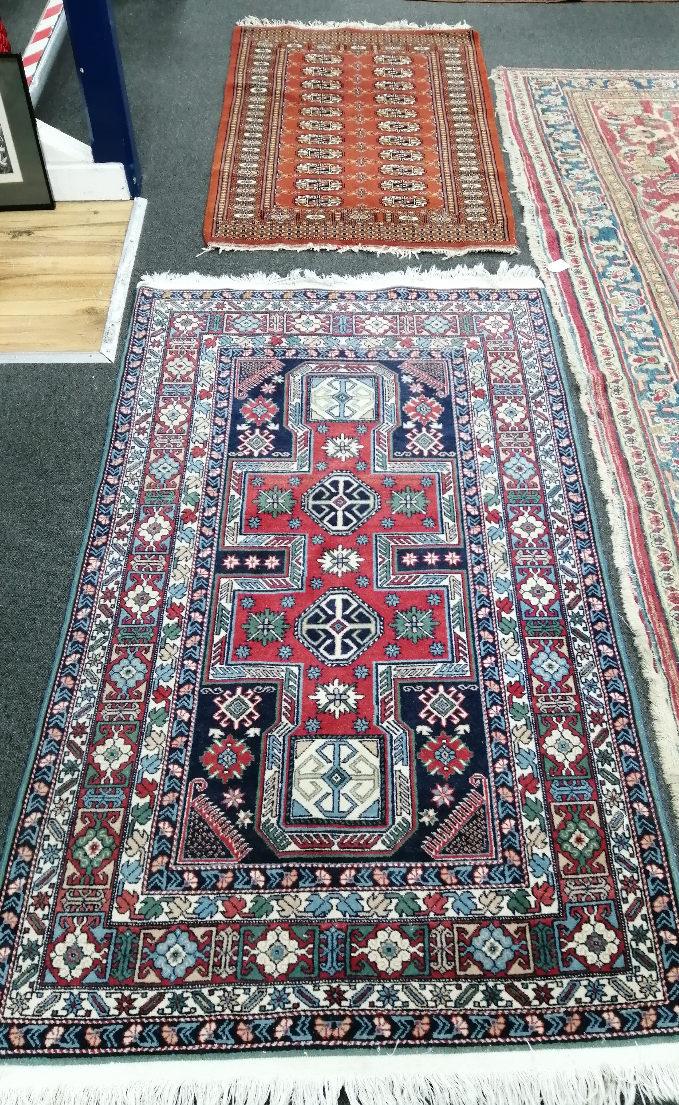 A Caucasian design blue ground rug and a Bokhara style red ground rug, 170 x 98cm and 128 x 81cm                                                                                                                            