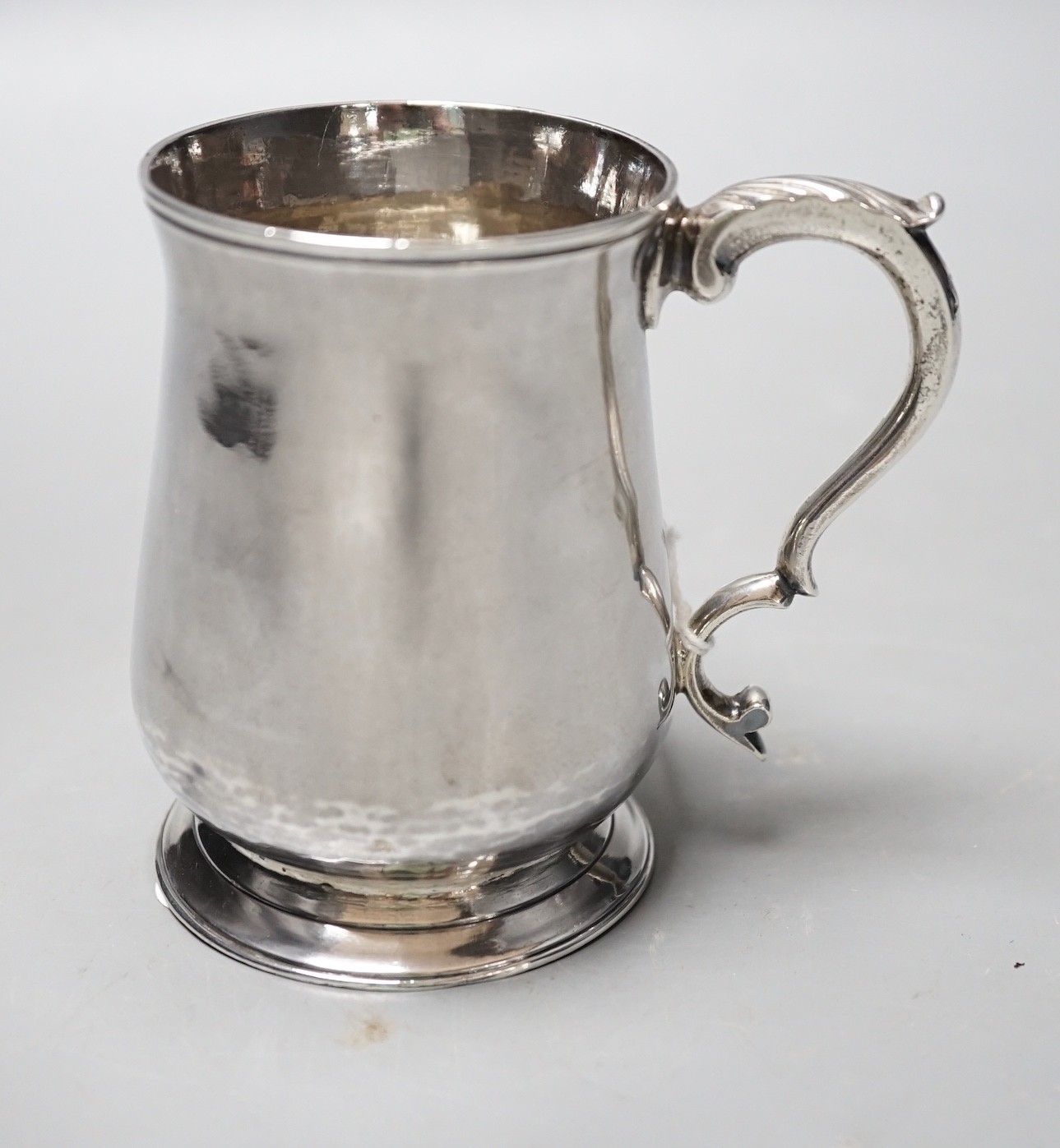 A George III small silver baluster mug, John King, London, 1777, 92mm, 5.3oz.                                                                                                                                               