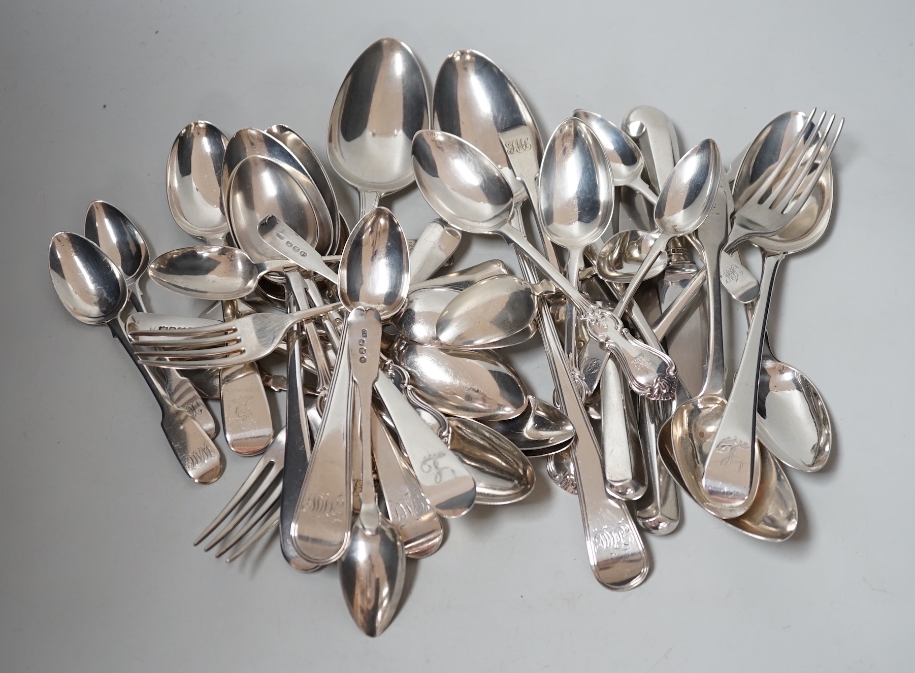 A canteen of mixed George III and later silver flatware, various patterns, dates and makers, 48.6oz.                                                                                                                        