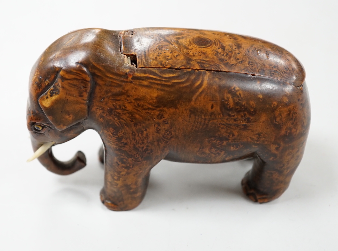 A 19th century burr wood ‘elephant’ snuff box, 11cm wide                                                                                                                                                                    