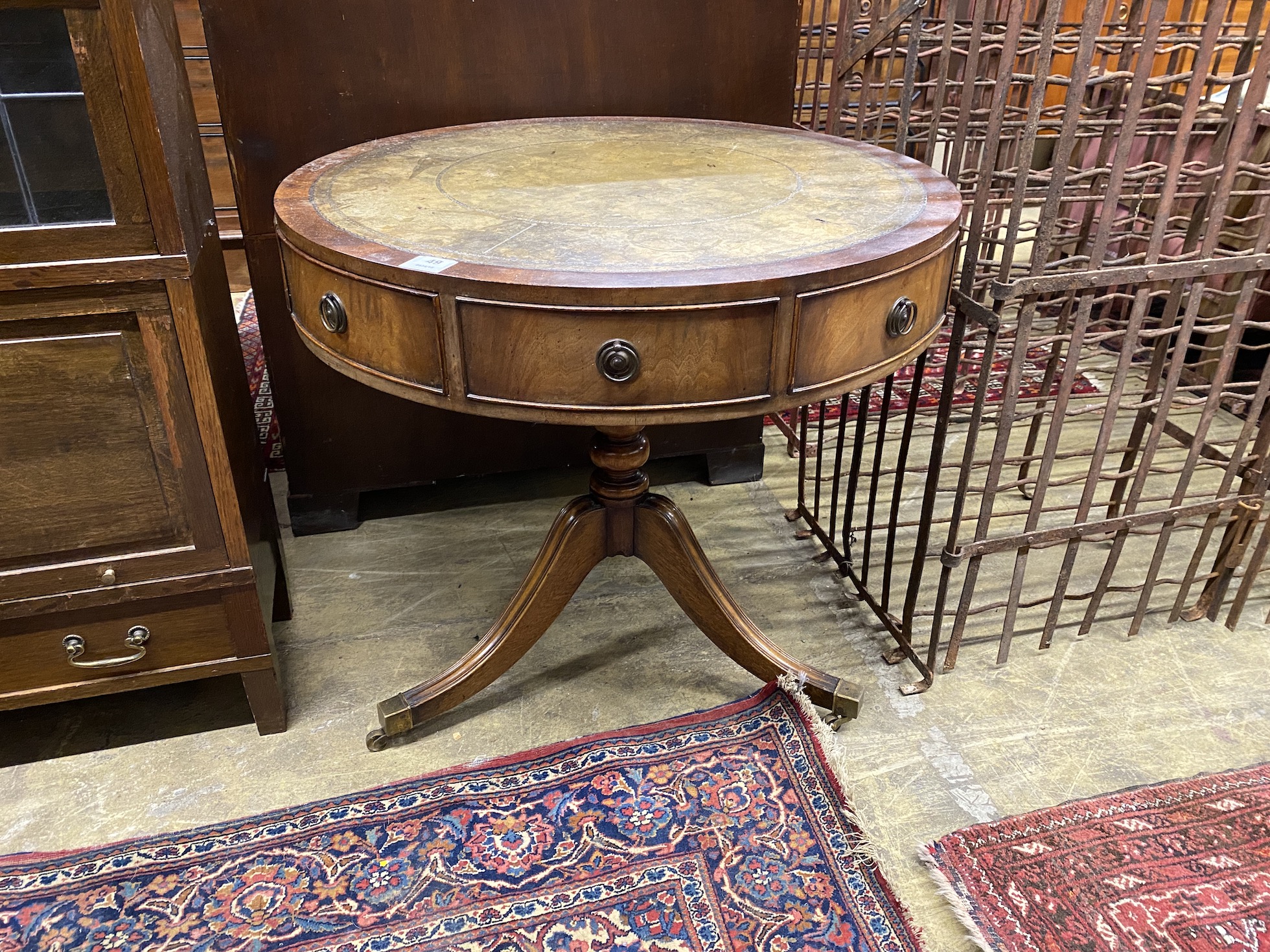 A reproduction mahogany small drum table with tooled green leather top, diameter 76cm, height 71cm                                                                                                                          