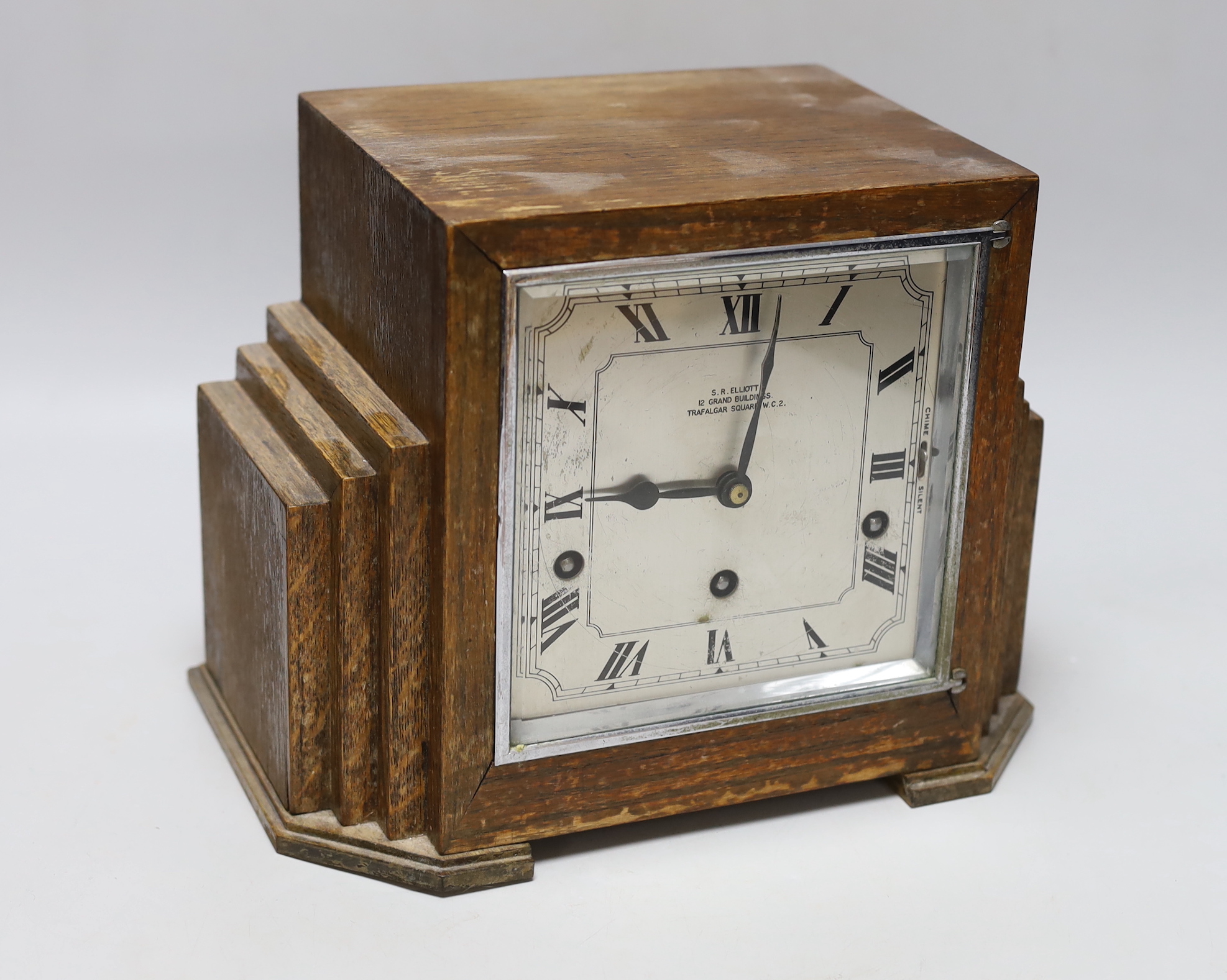 An Art Deco oak cased mantel clock by S R Elliot, 26cm wide                                                                                                                                                                 