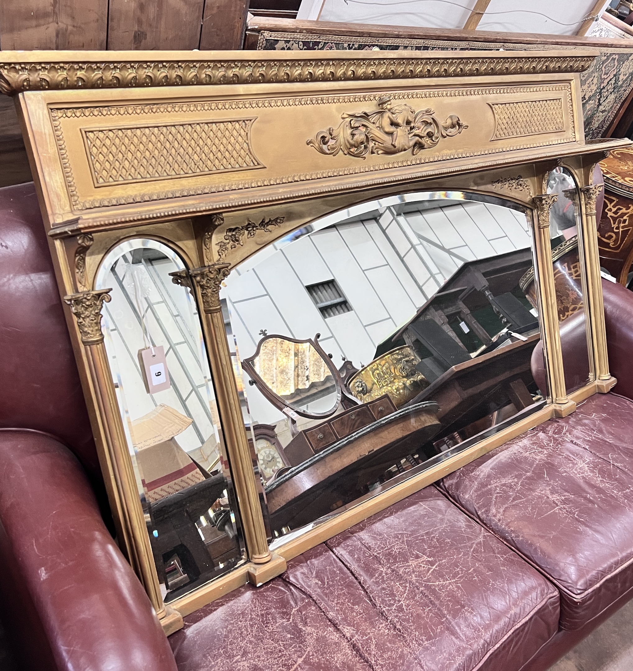 A late Victorian giltwood and composition triple plate overmantel mirror, width 144cm, height 85cm                                                                                                                          