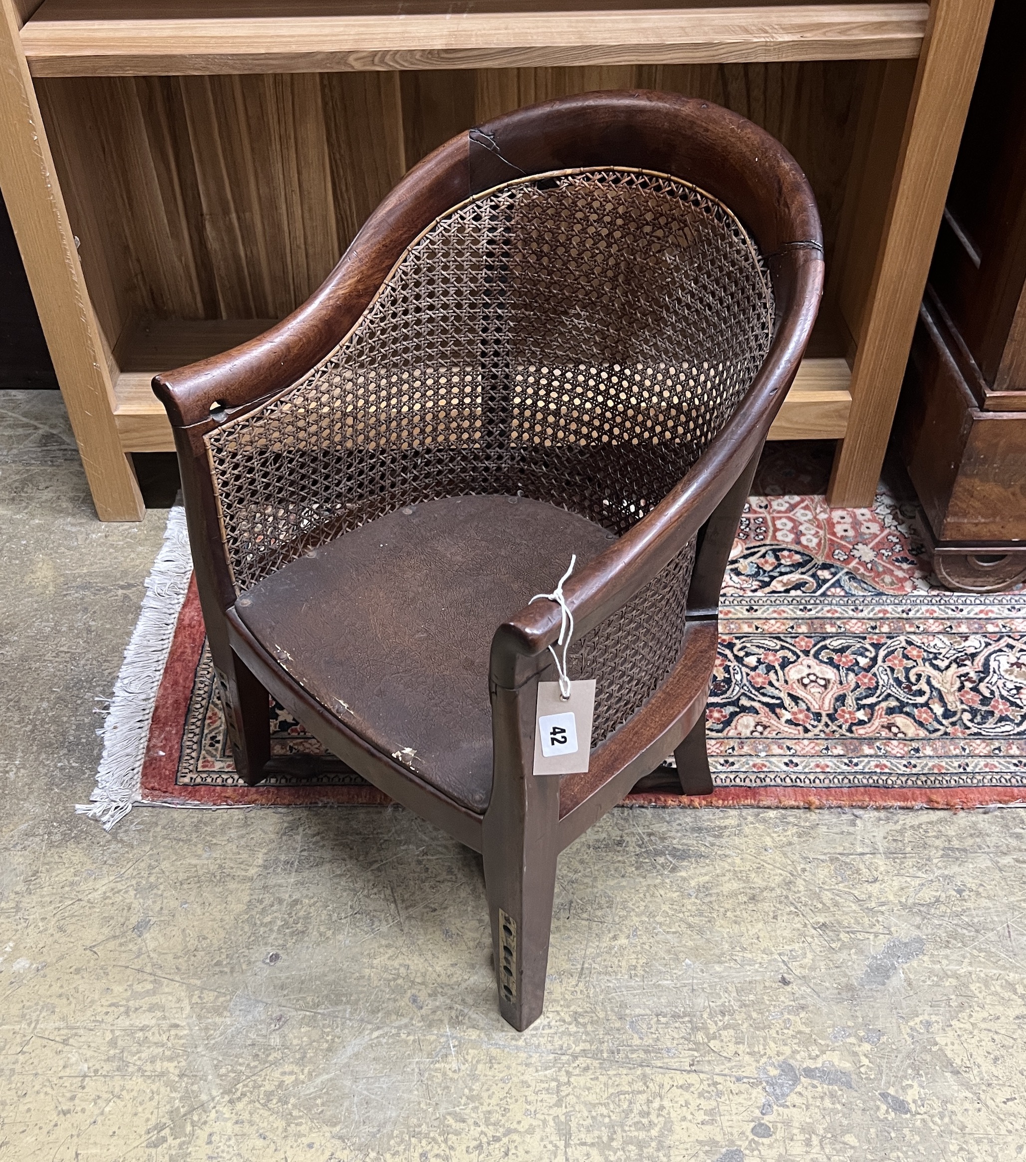 A Regency caned mahogany tub framed child's chair, width 38cm, height 58cm                                                                                                                                                  