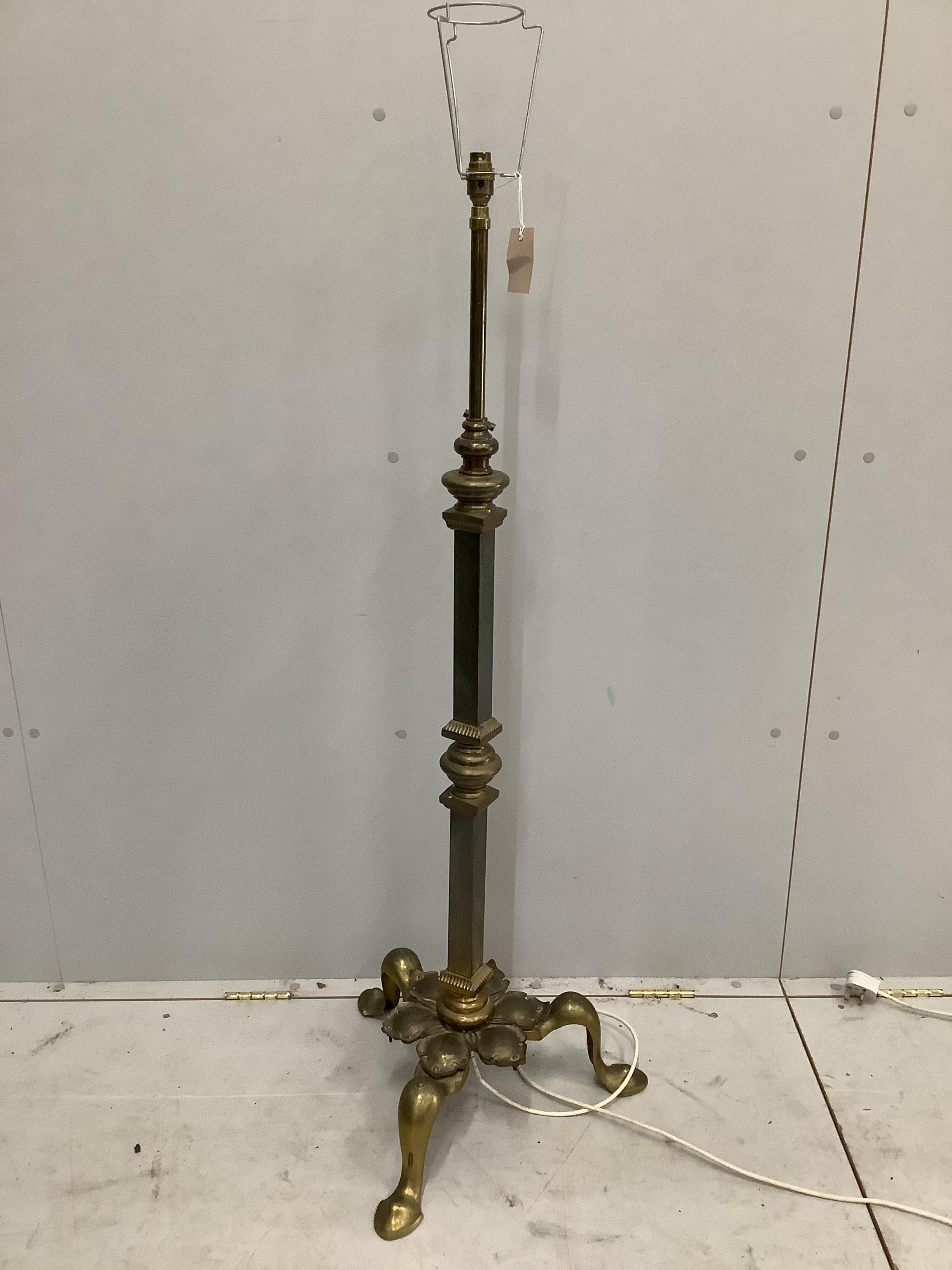 An Arts and Crafts style brass telescopic standard lamp                                                                                                                                                                     