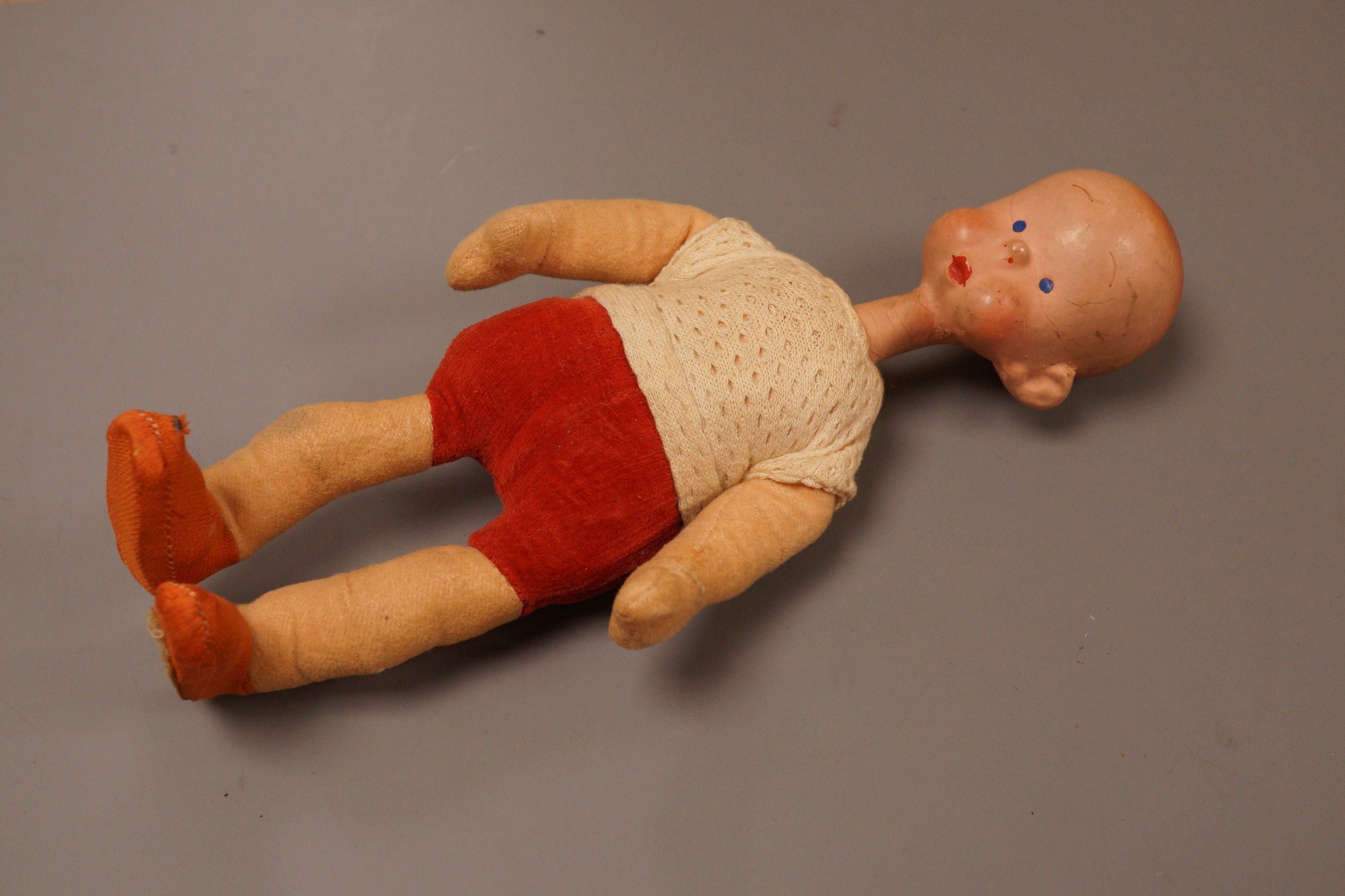 A rare Deans Rag book Henry doll, in original condition, c.1930, some slight staining to the face, 22cm                                                                                                                     