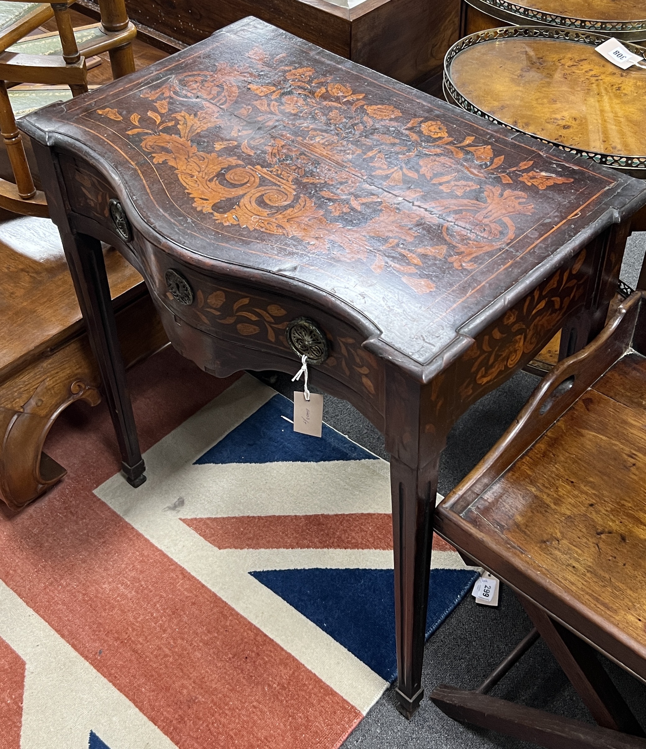 A late 18th century Dutch floral marquetry walnut serpentine side table, width 70cm, depth 45cm, height 74cm                                                                                                                