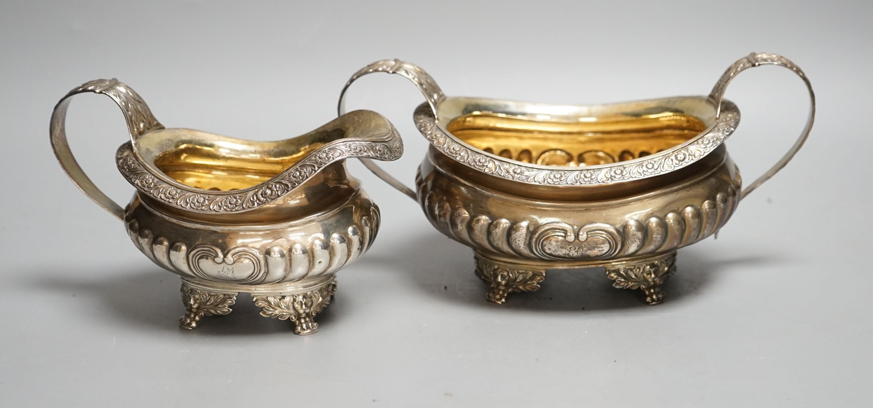 A late George III silver sugar bowl and cream jug, Robert Smeaton, Edinburgh, 1819, gross 19oz.                                                                                                                             