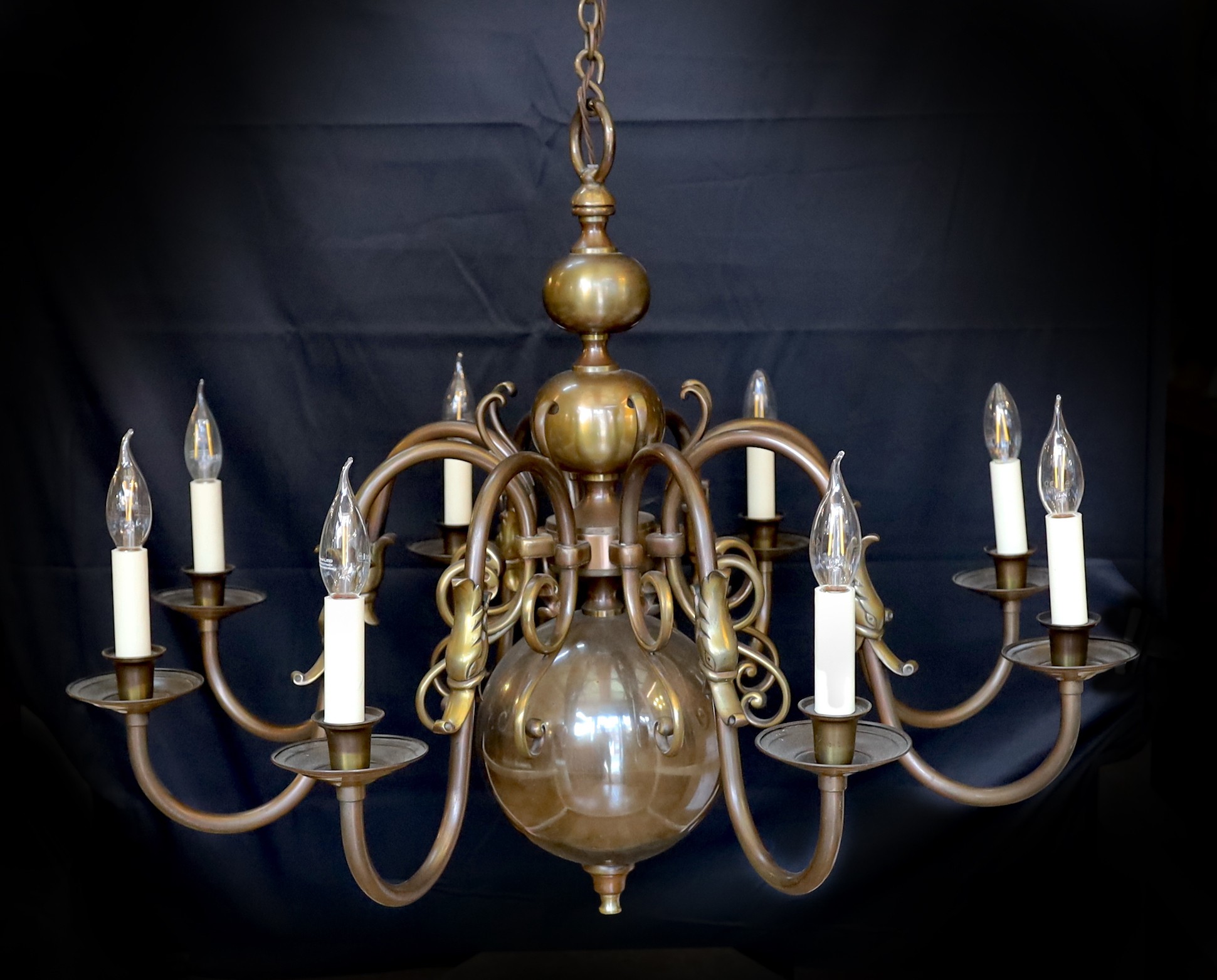 A large Dutch bronzed brass eight light chandelier, drop 70cm. width 86cm                                                                                                                                                   