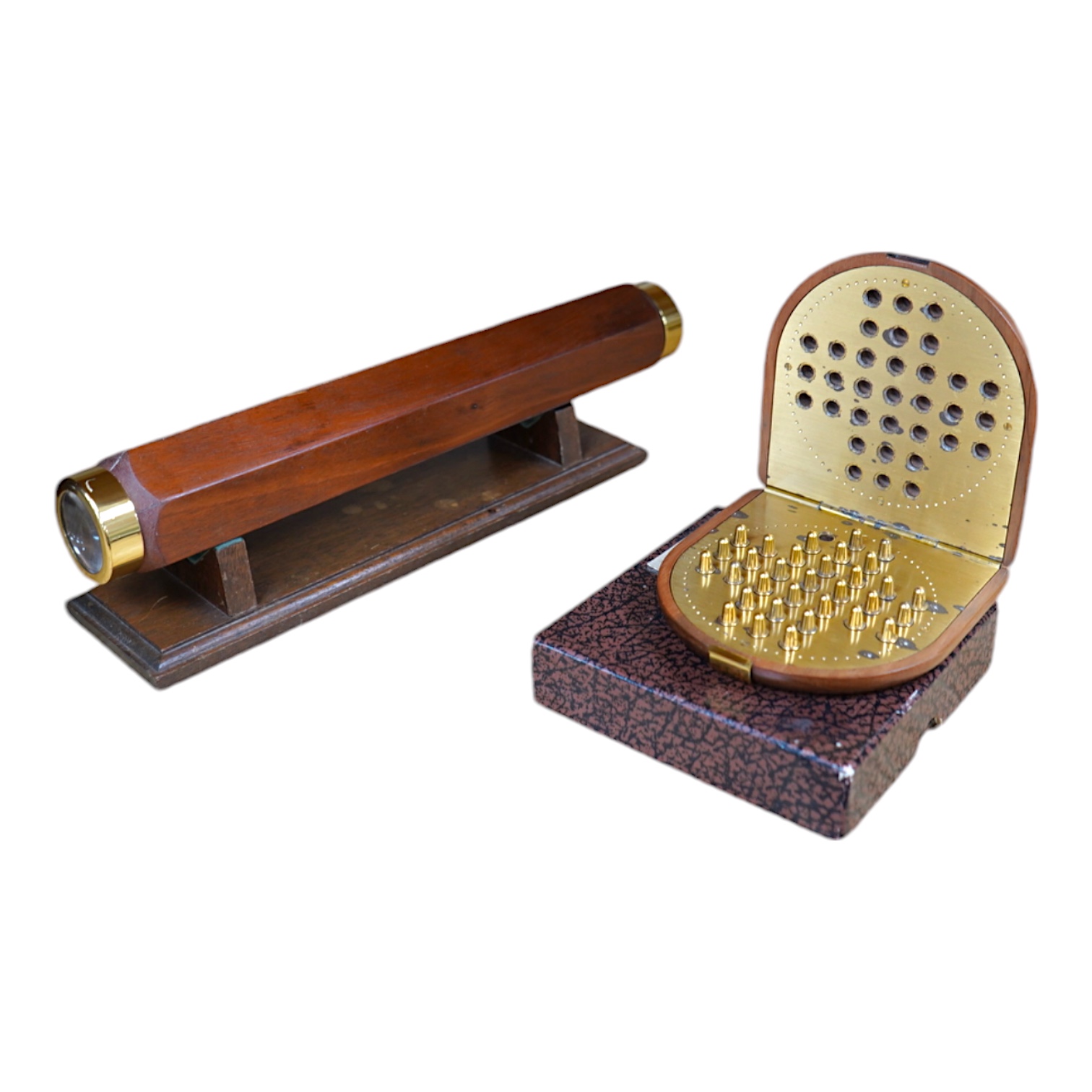 A reproduction 19th century style wooden bodied kaleidoscope on stand, 29.5cm, together with a wood cased brass solitaire set (one peg missing), 10.5cm diameter. Condition - fair.                                         