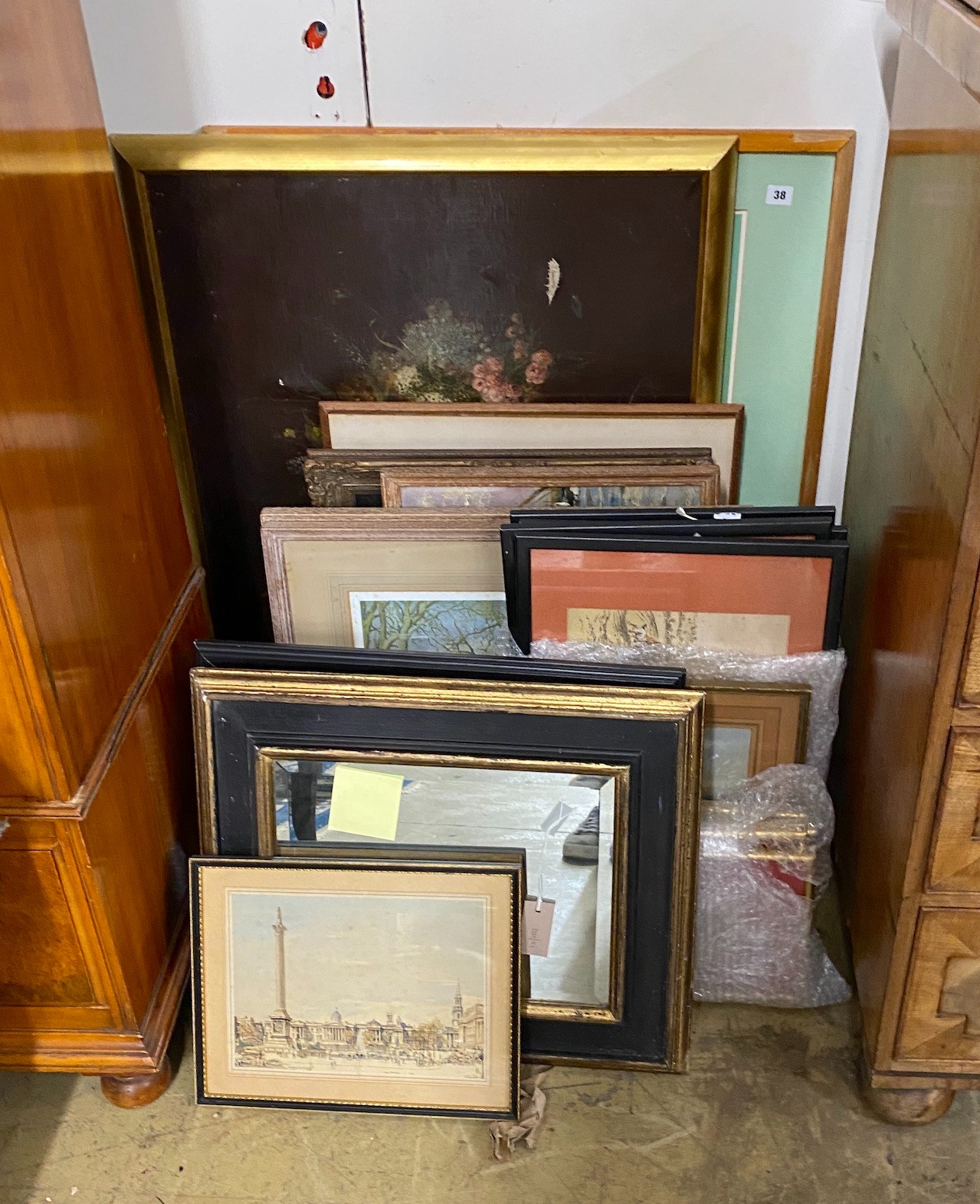 A collection of assorted oils, watercolours and prints and a rectangular wall mirror                                                                                                                                        