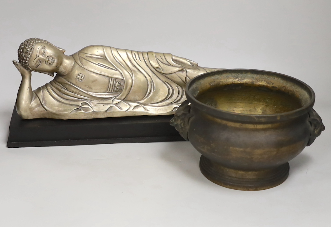 A Chinese silvered metal reclining Buddha and a two handled censer, reclining Buddha 41cm wide                                                                                                                              
