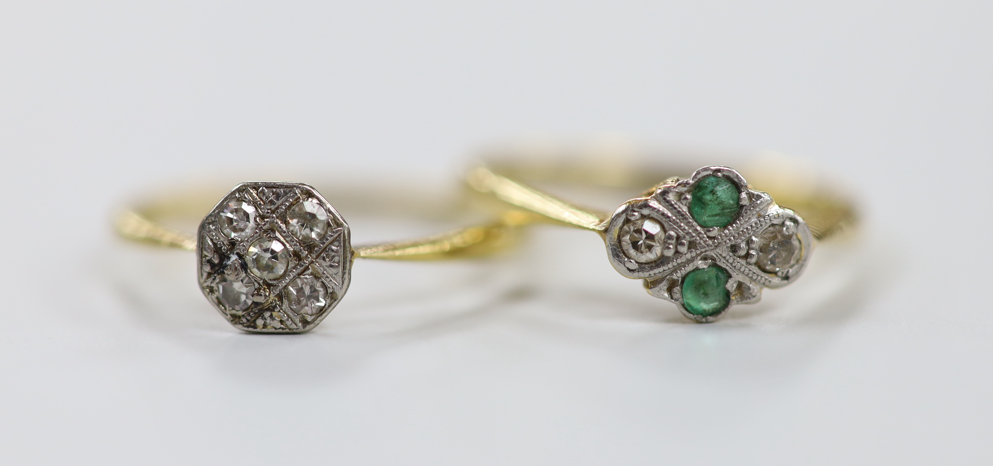 A 1920's 18ct & plat, emerald and diamond set four stone ring, size M/N and a similar five stone diamond chip cluster ring size O, gross weight 4 grams.                                                                    