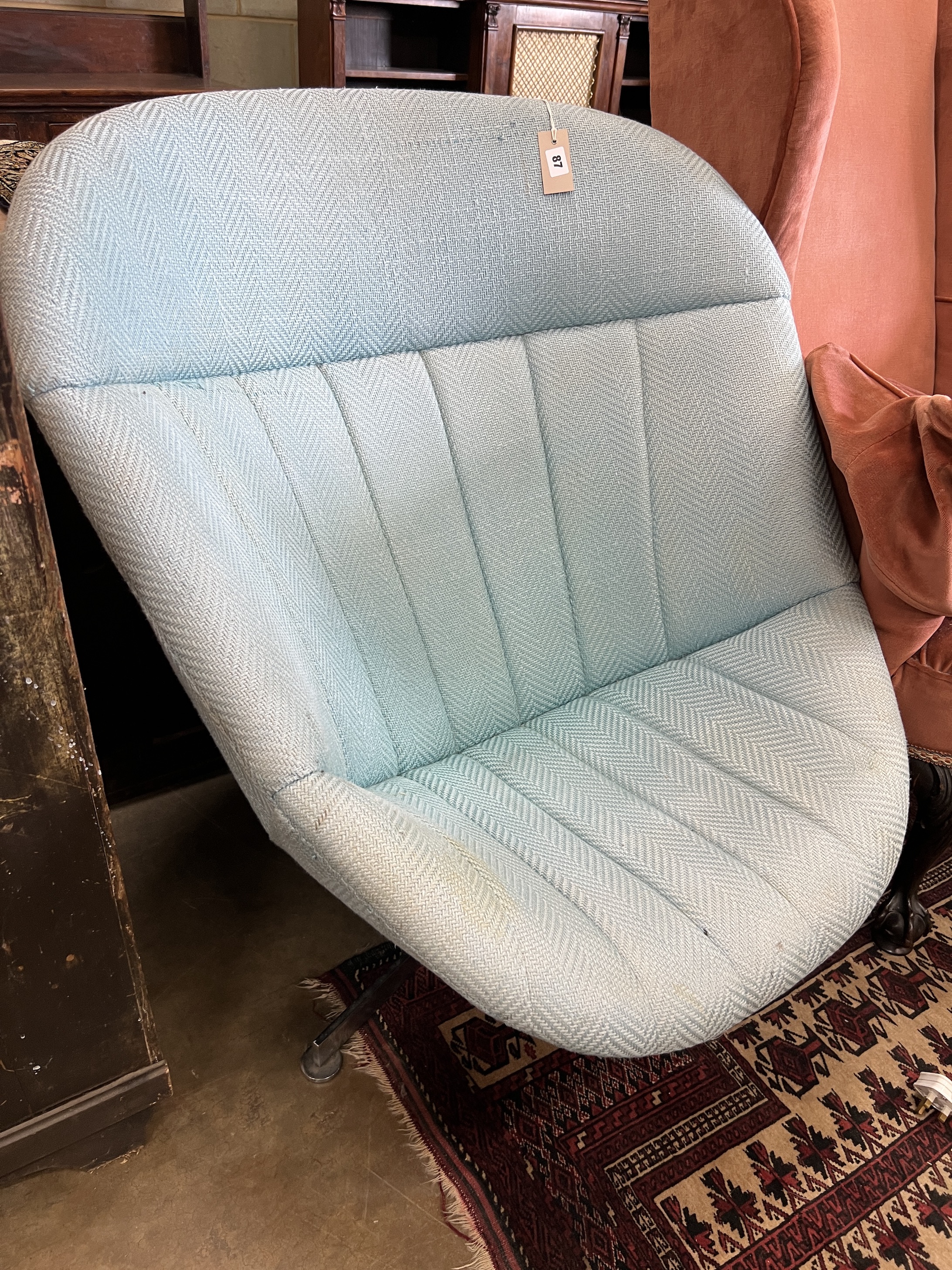 A mid century upholstered egg chair on chrome swivel base, width 86cm, depth 80cm, height 94cm                                                                                                                              