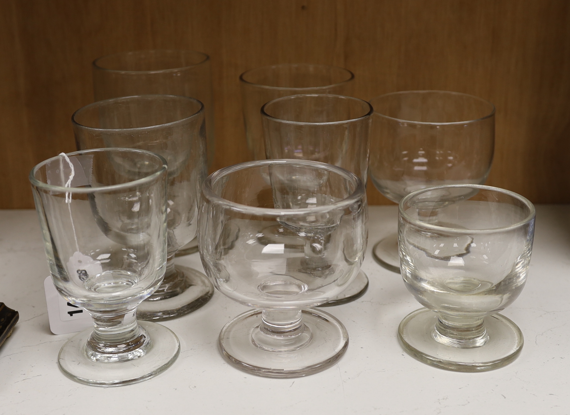 Eight varying sized glass rummers, tallest 15.5cm high                                                                                                                                                                      