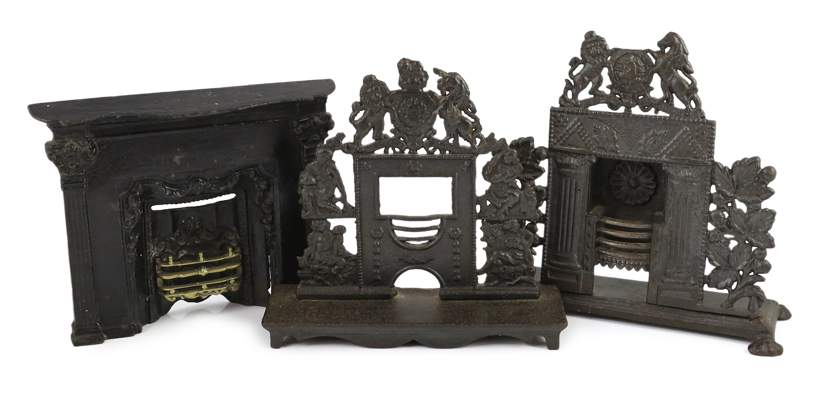 Three early 19th century cast iron model fire grates, two incorporating Royal Arms, largest 12in. wide                                                                                                                      