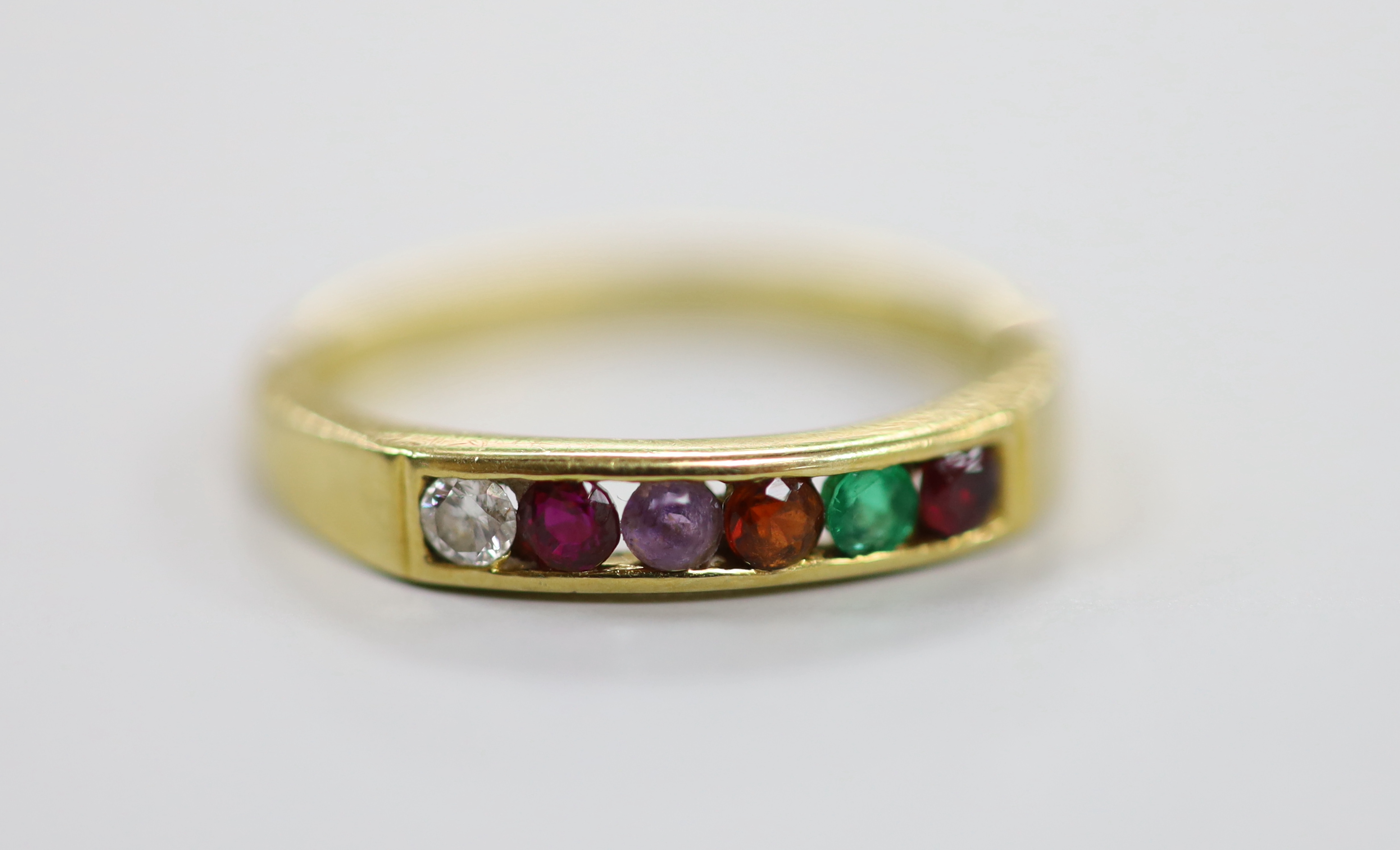 A modern 18ct gold and gem set half hoop 'Regard' ring, size L/M, gross weight 2.7 grams.                                                                                                                                   