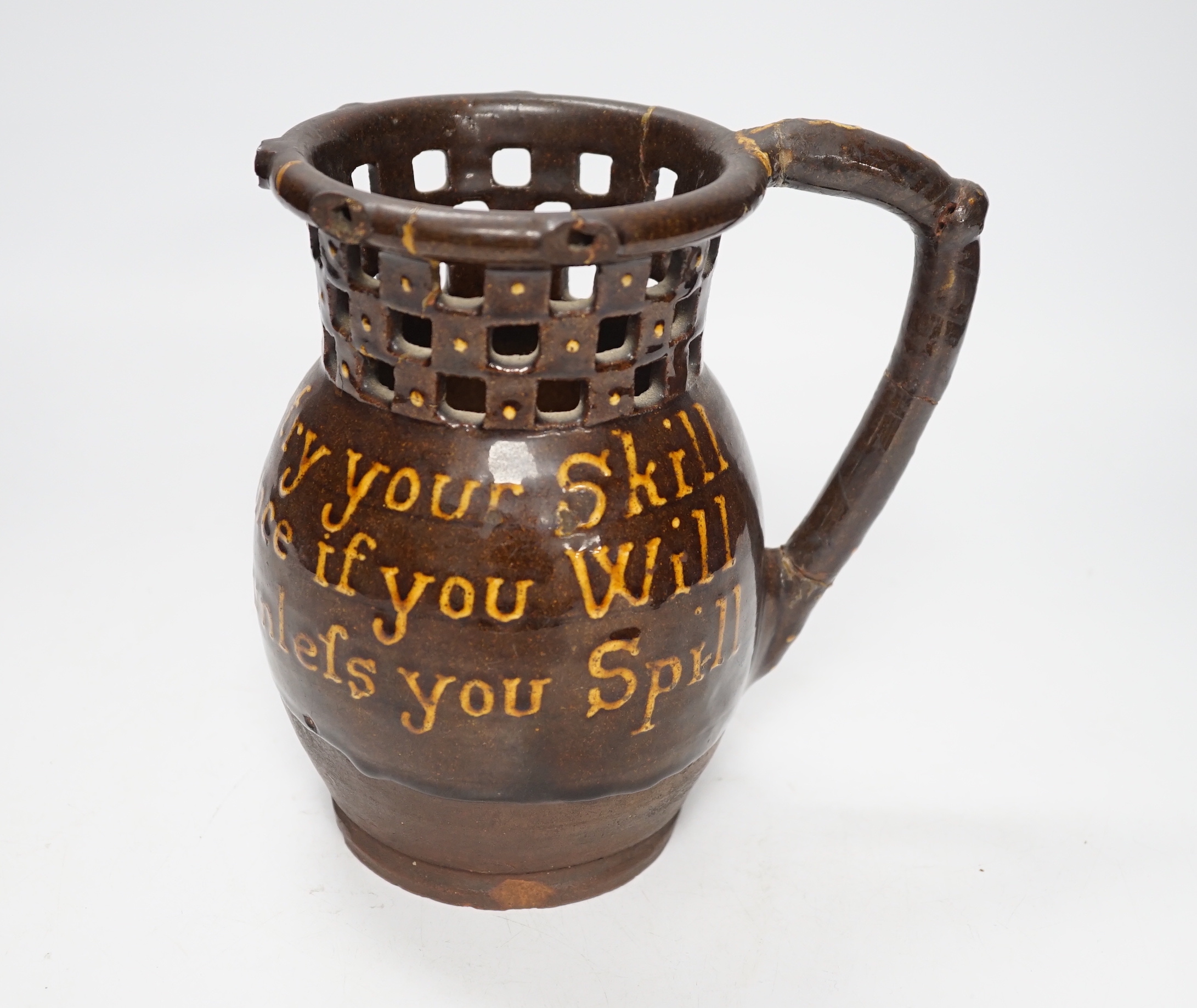 A 19th century slipware puzzle jug, 19cm                                                                                                                                                                                    