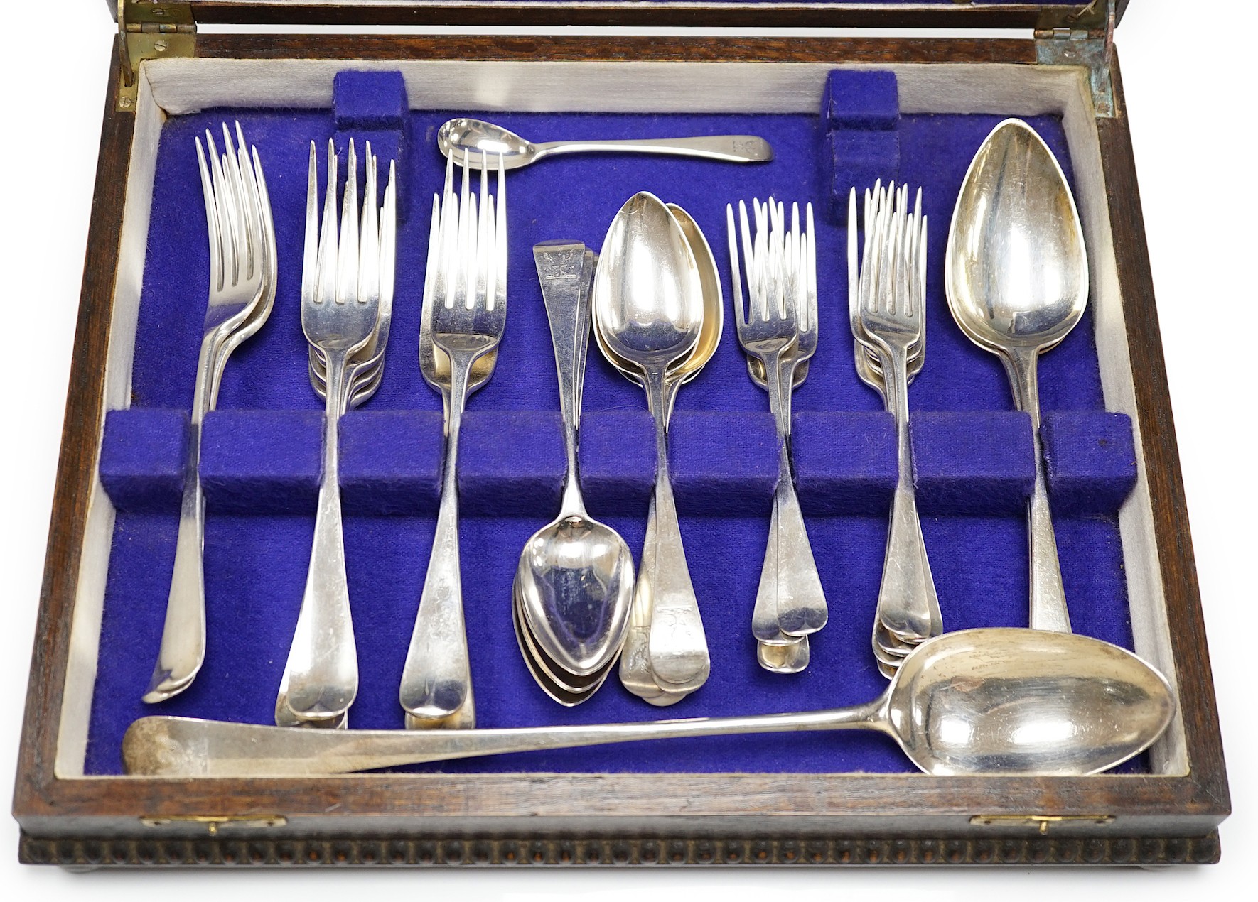 A part canteen of 19th century silver flatware, various dates, patterns and makers, including a set of eight George III silver dessert forks, Thomas Wallis II, London, 1806 and a set of eight dessert spoons, Richard Cros