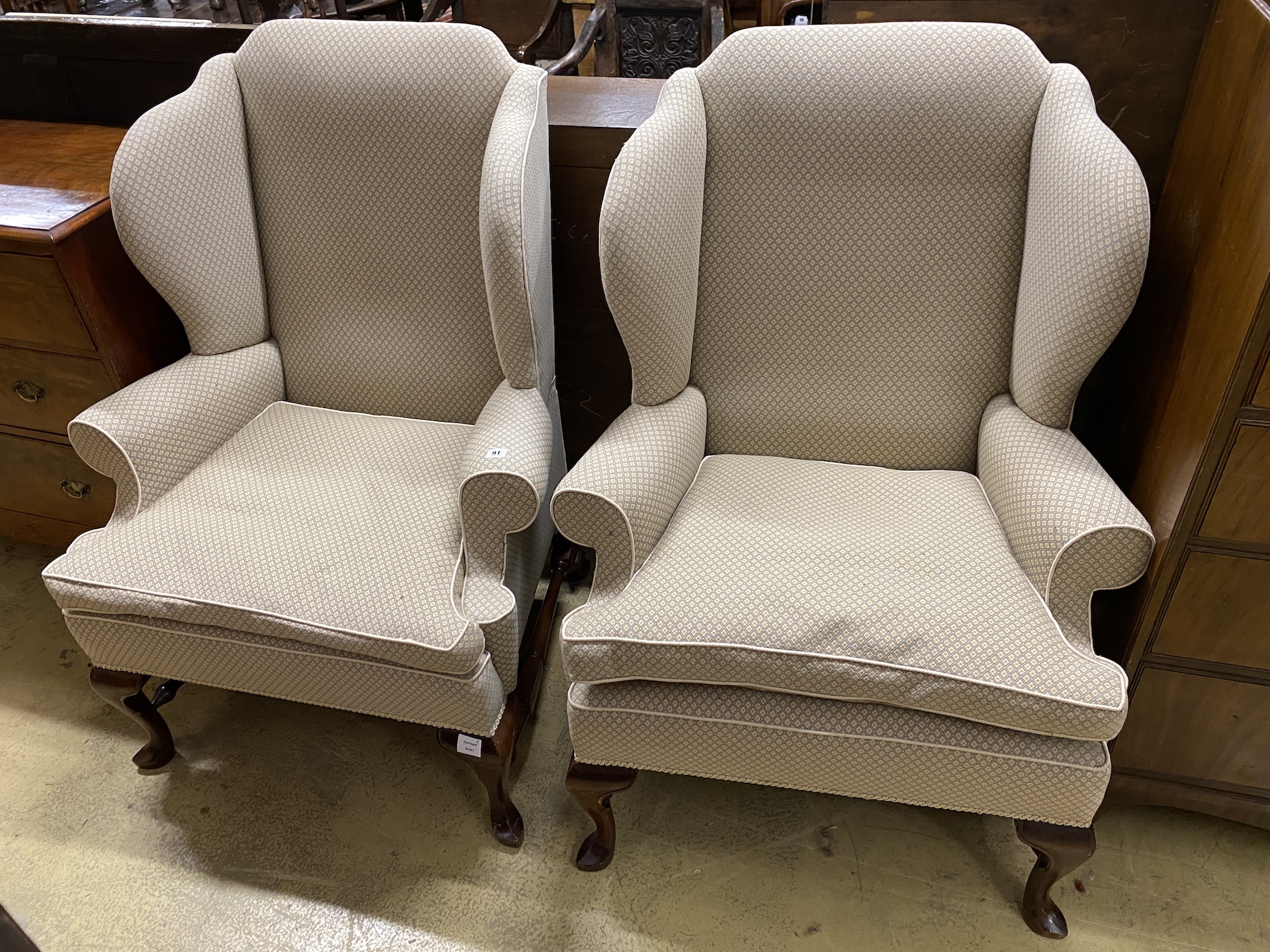 A good pair of George III style upholstered wing armchairs, width 84cm, depth 74cm, height 116cm                                                                                                                            