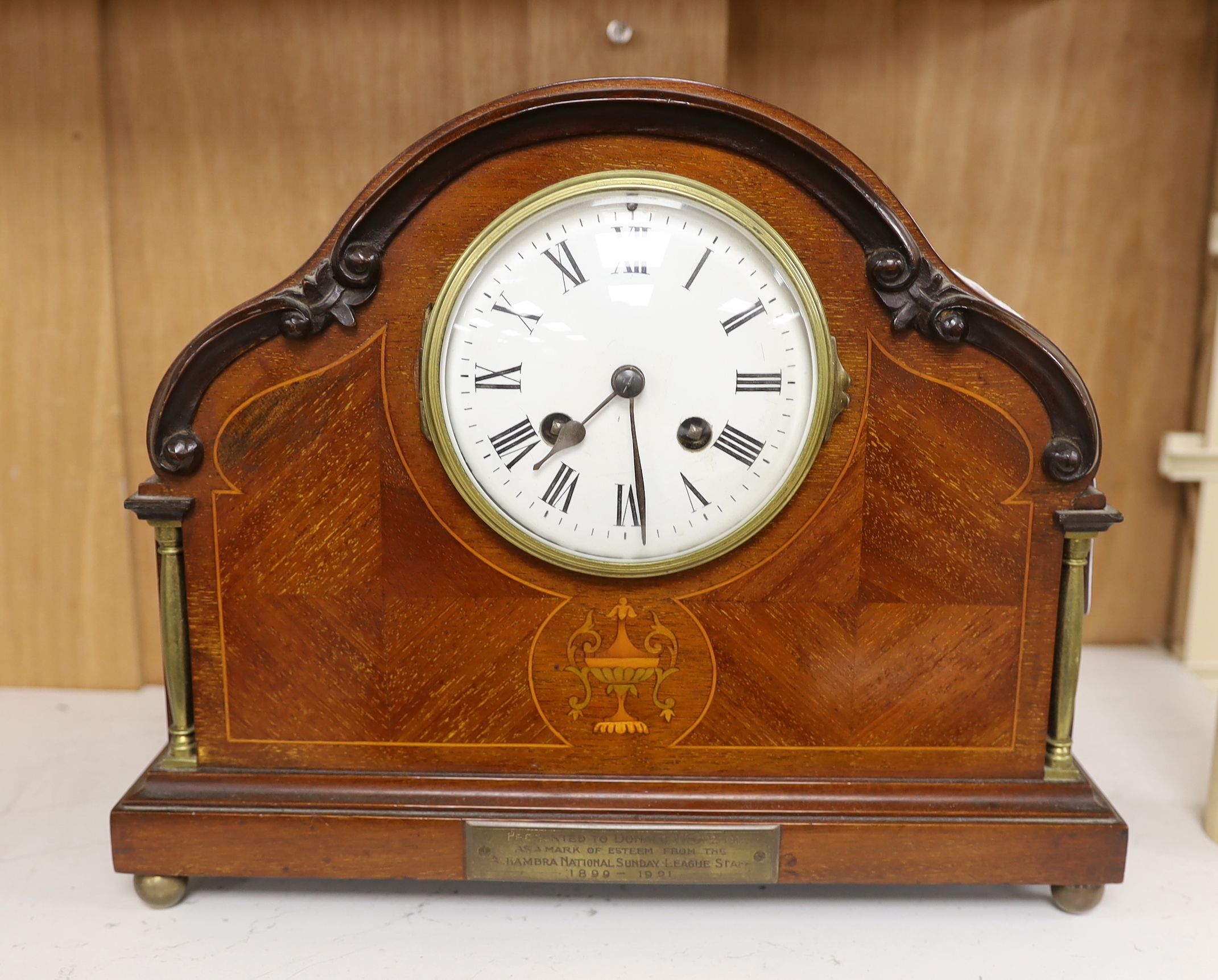 An Edwardian inlaid mantel timepiece, 30.5cm wide                                                                                                                                                                           