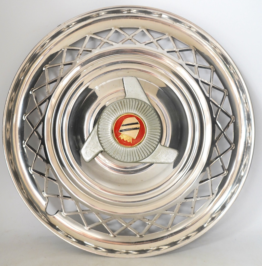 A set of four 1960s US chrome plated automobile hub caps, 38cm diameter. Condition - fair to good                                                                                                                           