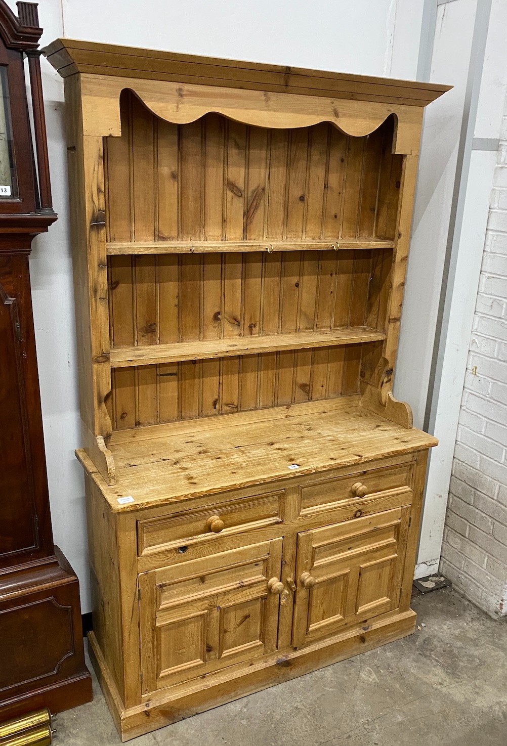 A Victorian style pine kitchen dresser, width 117cm, depth 43cm, height 194cm                                                                                                                                               