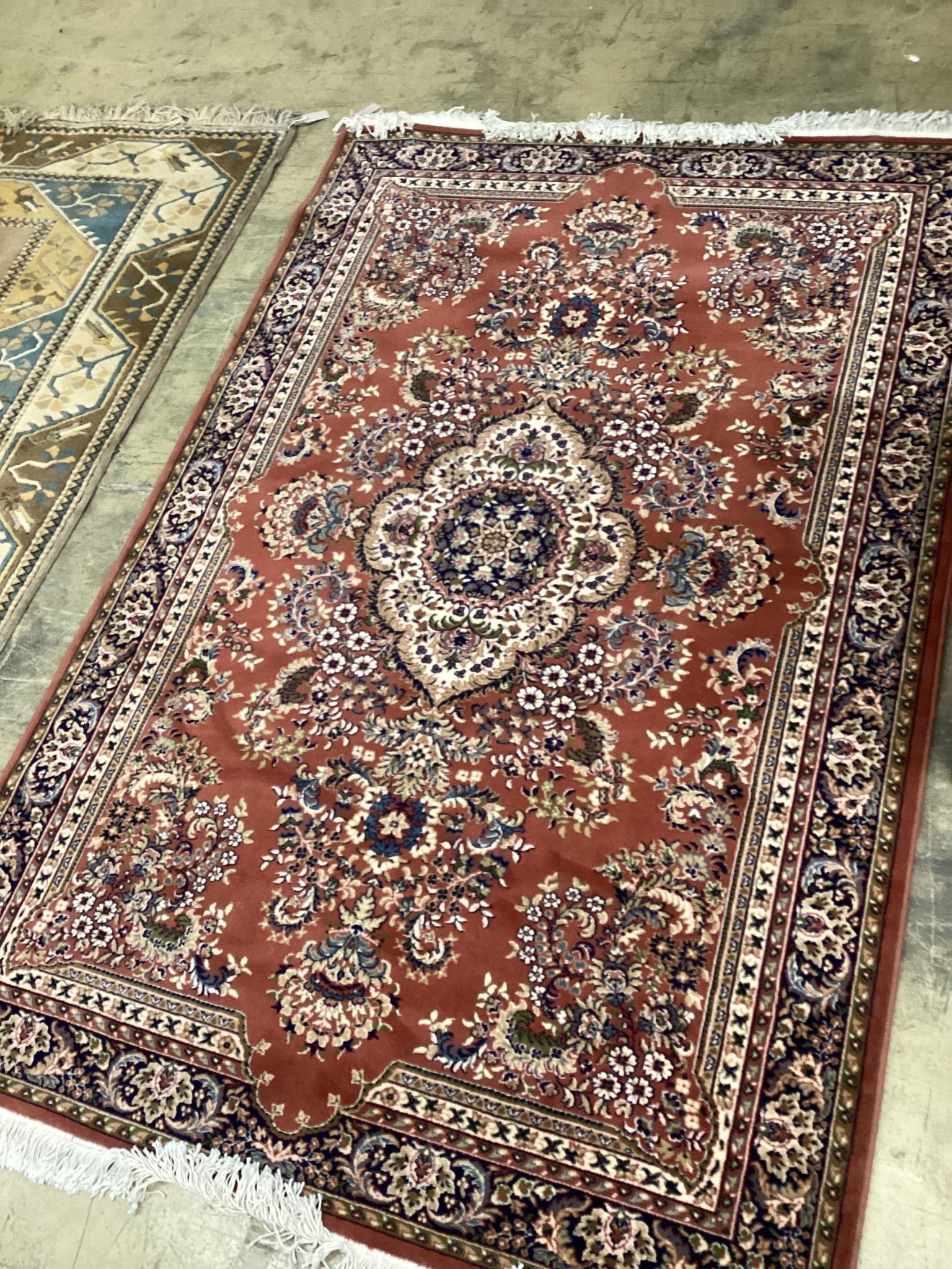 A modern Tabriz style red ground rug, 240 x 162cm                                                                                                                                                                           