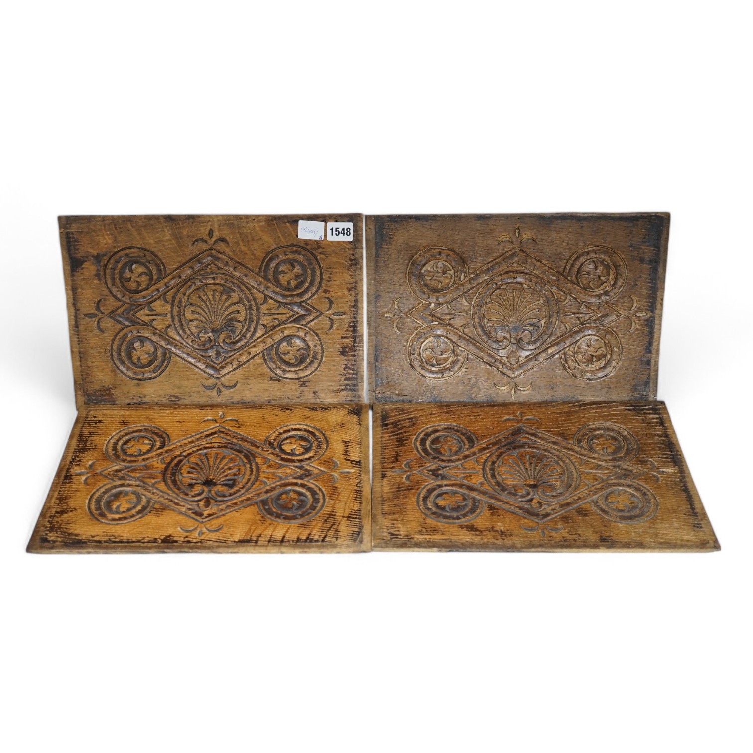 A set of four 18th century carved oak panels, 37cm x 25cm. Condition - two have splits                                                                                                                                      