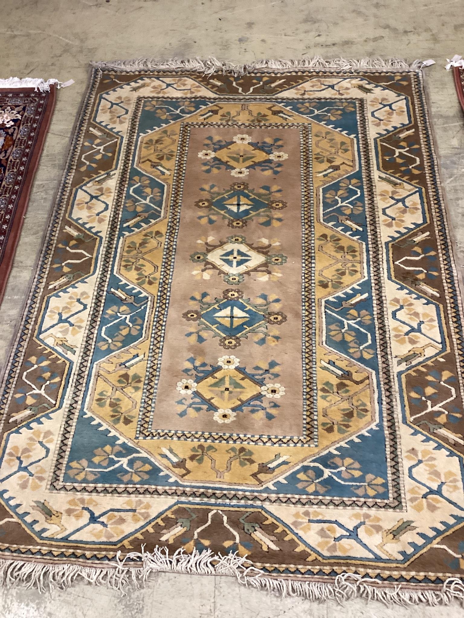 A modern Caucasian style fawn ground rug, 230 x 168cm                                                                                                                                                                       