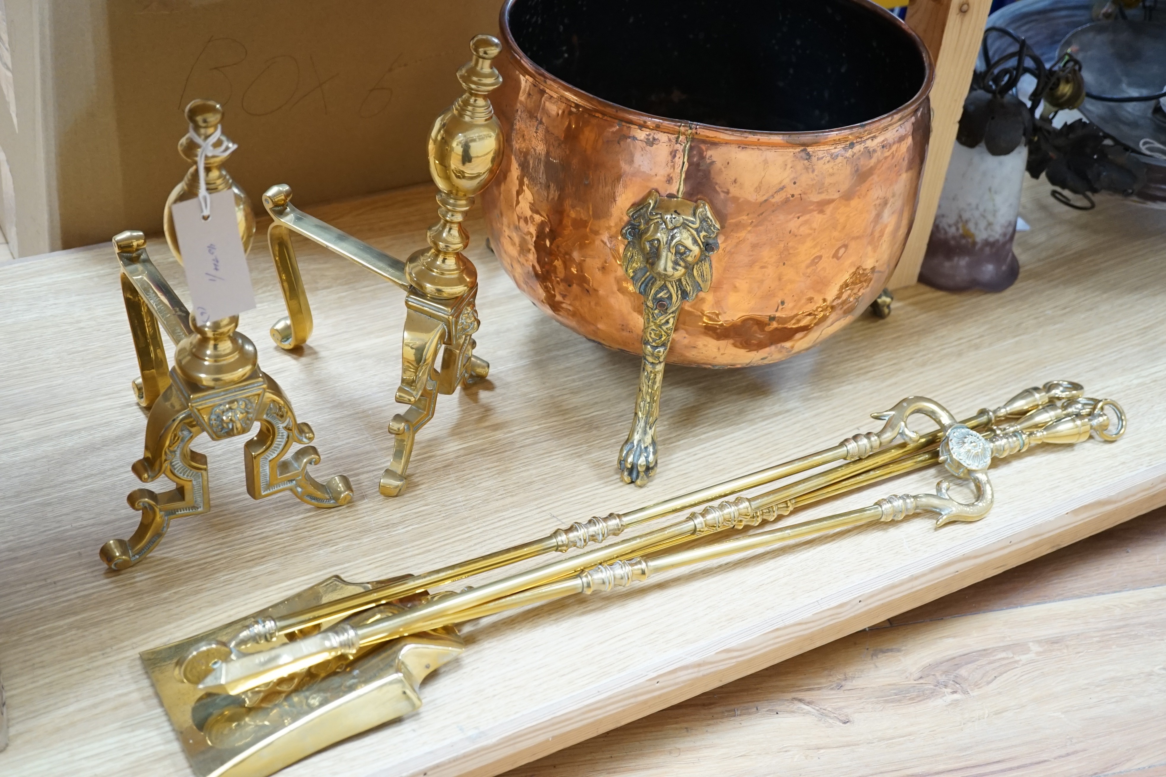 A set of three Victorian brass fire irons, a pair of fire dogs and a copper log bin                                                                                                                                         