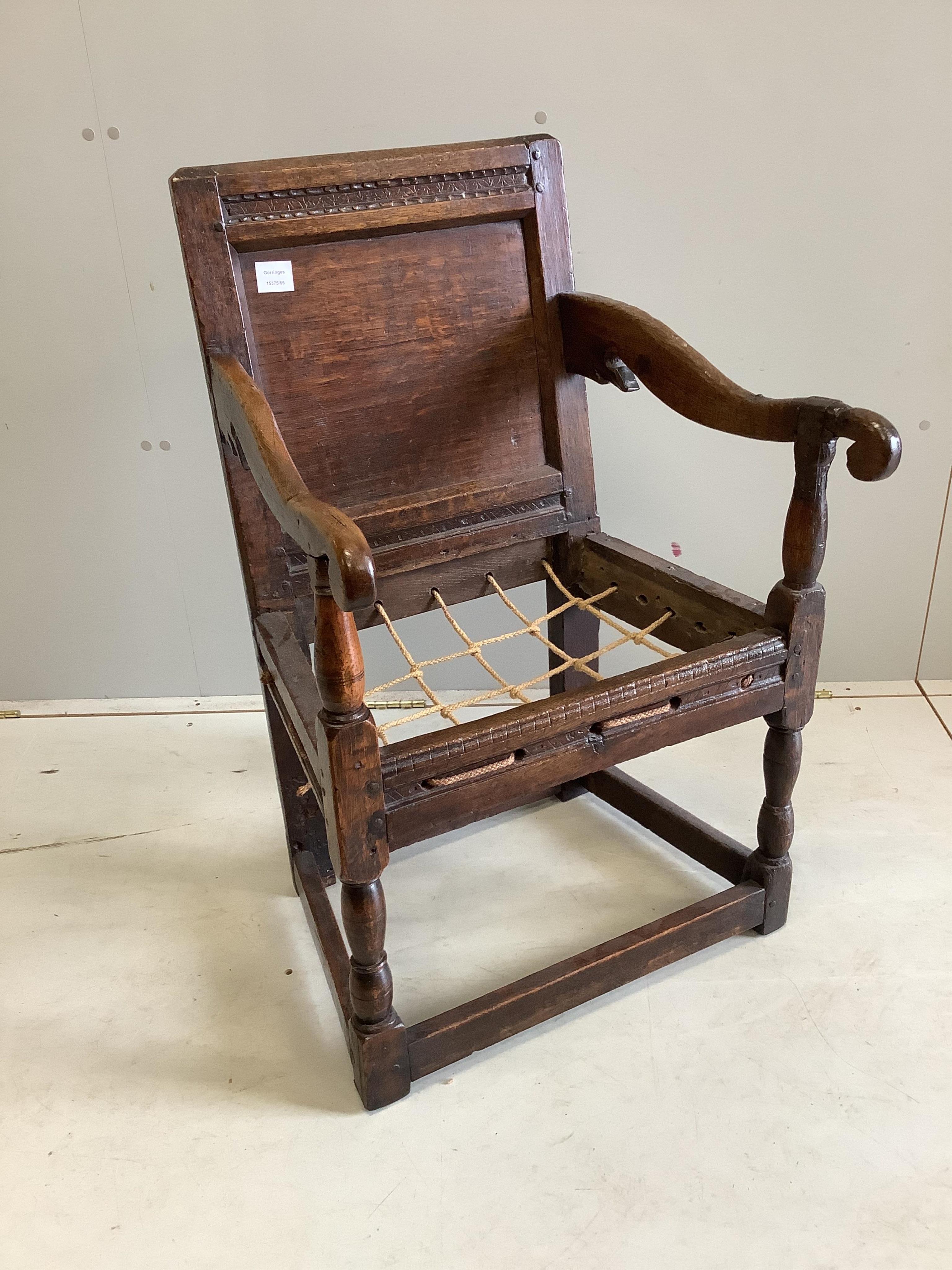 A 17th century oak wainscot elbow chair, width 56cm, depth 52cm, height 89cm. Condition - poor-fair                                                                                                                         