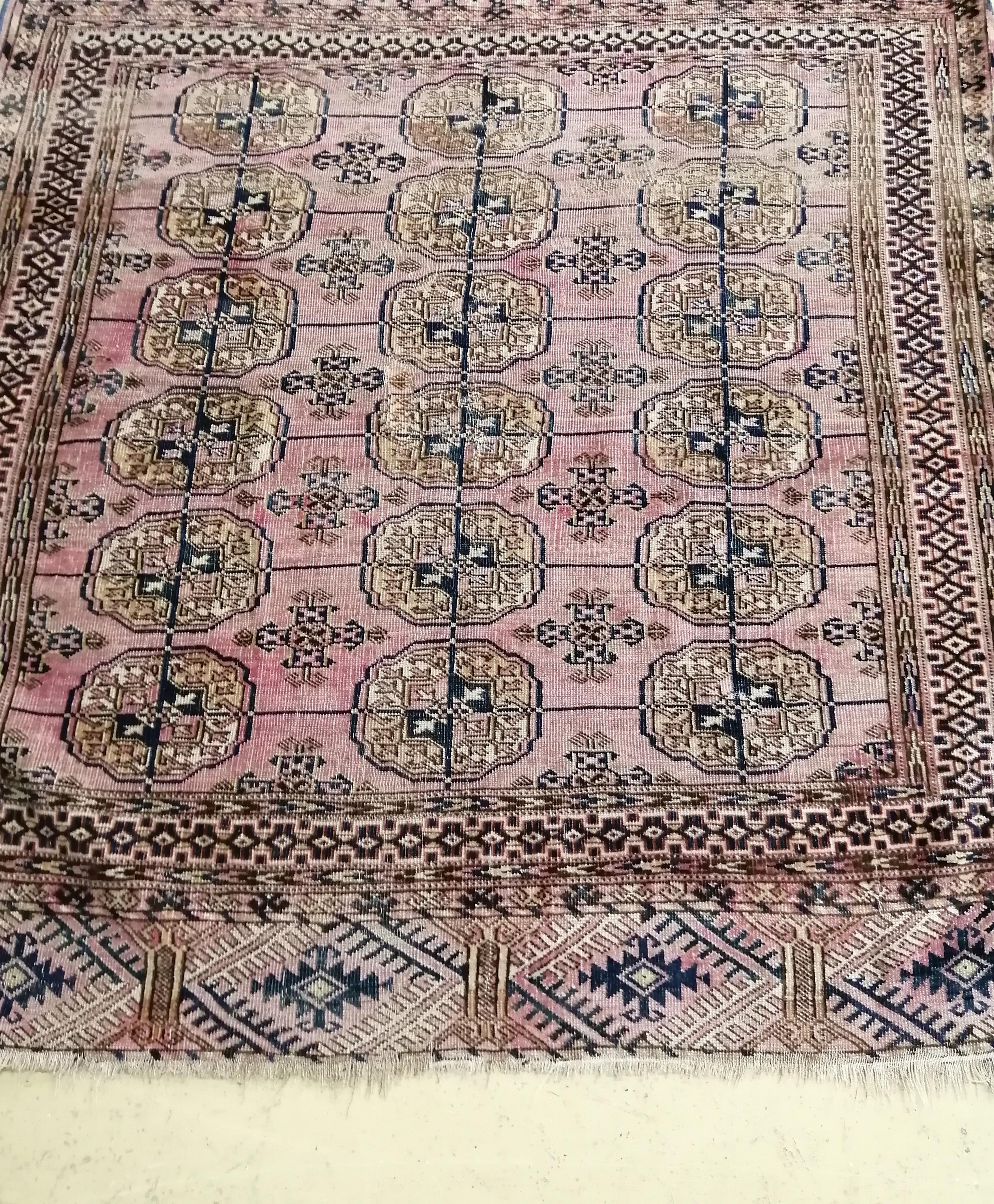 A Bokhara peach ground rug, 120 x 118cm                                                                                                                                                                                     