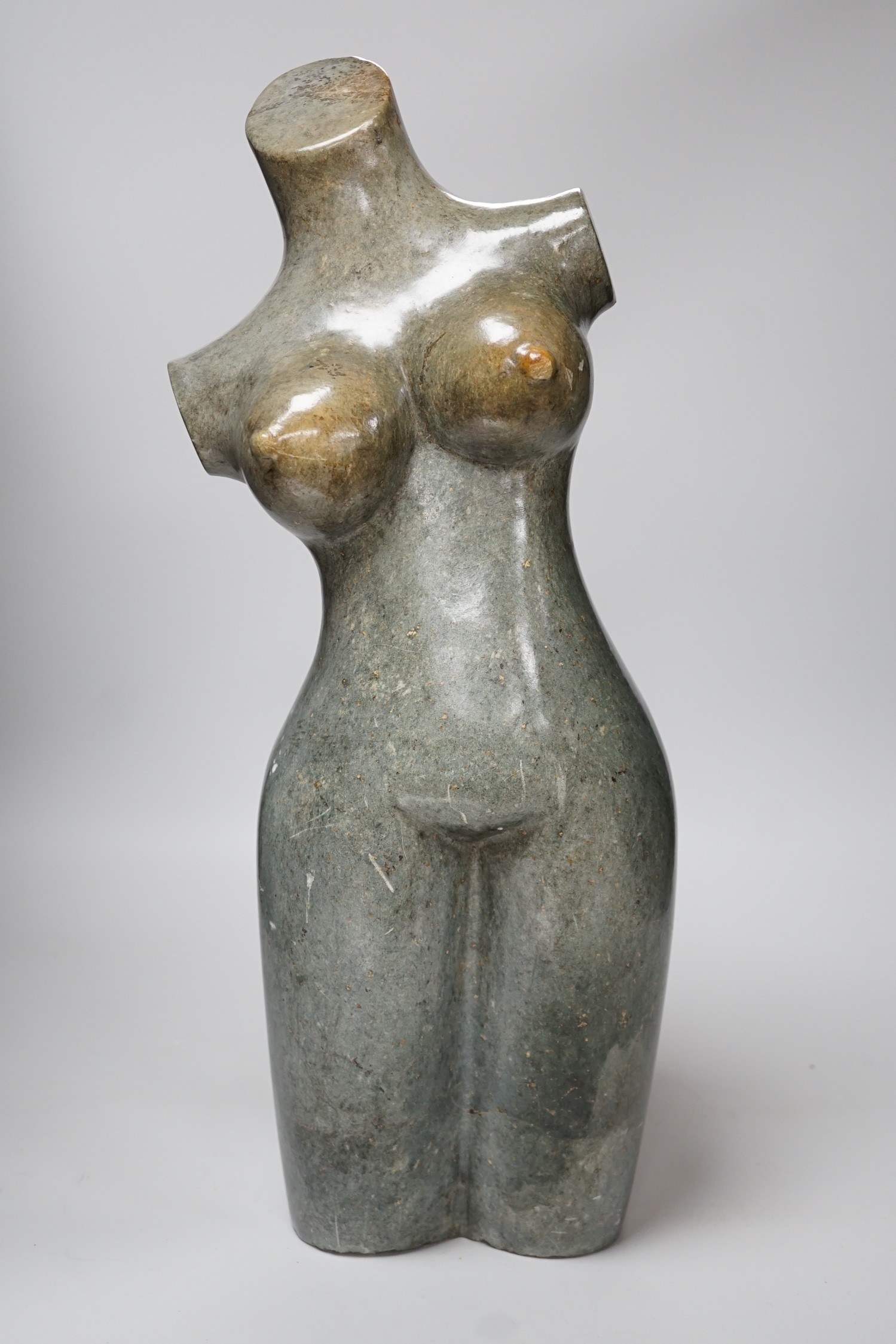 Daniel Baradza (Zimbabwean). A large carved stone female torso, 52cms high                                                                                                                                                  