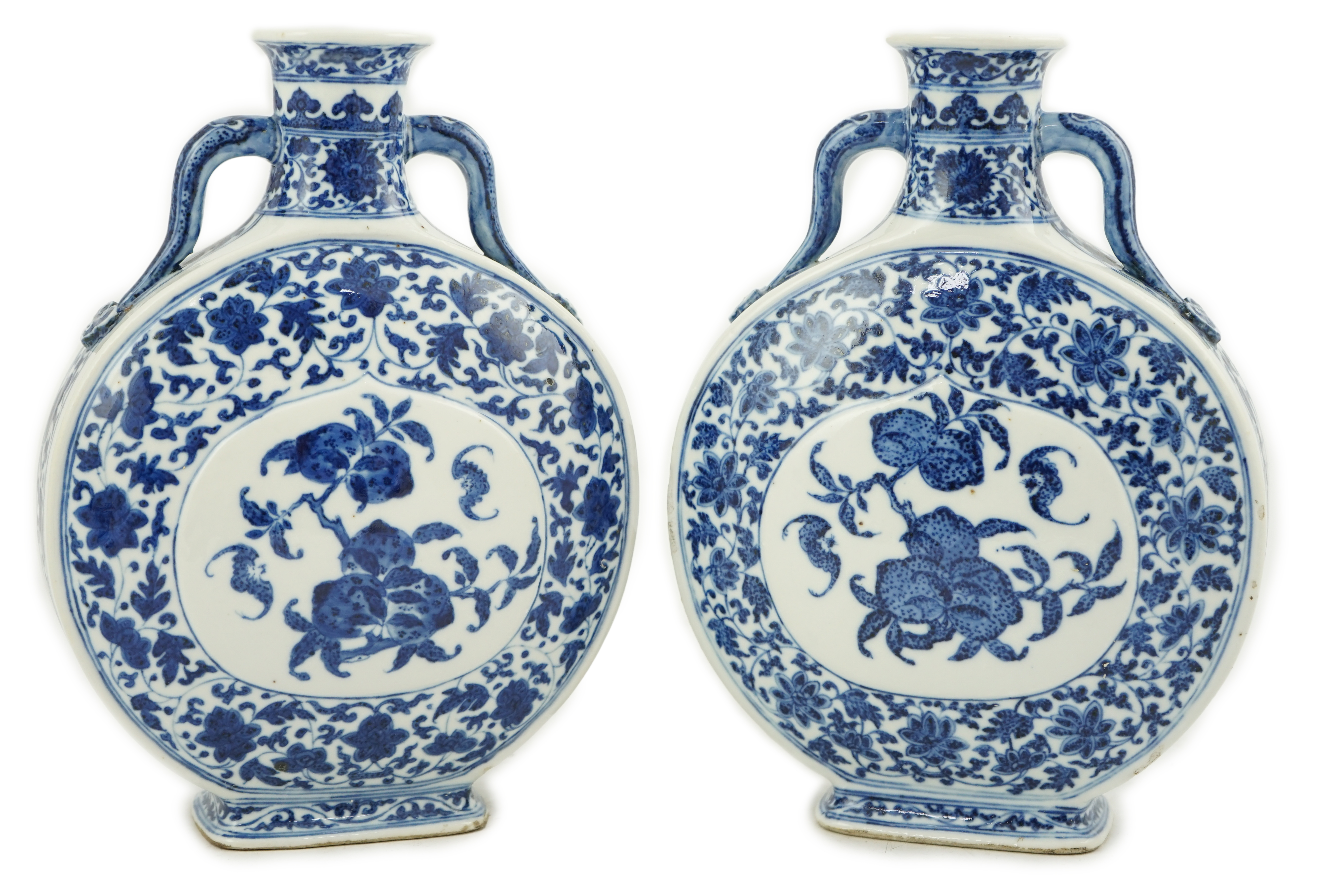 A near pair of Chinese blue and white moonflasks, bianhu, Daoguang seal marks and of the period (1821-50)                                                                                                                   