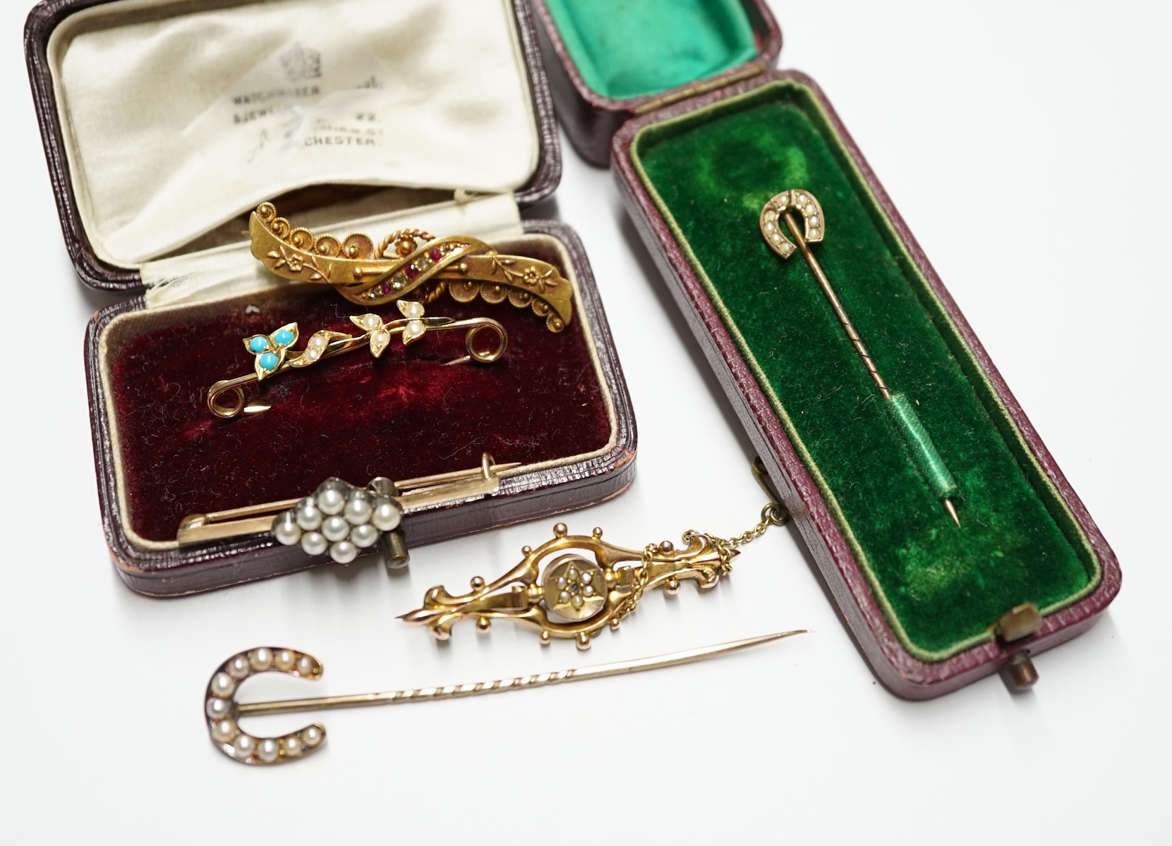 A 15ct gold, ruby and diamond set bar brooch, four other bar brooches including 9ct and two stick pins. Condition - poor to fair                                                                                            