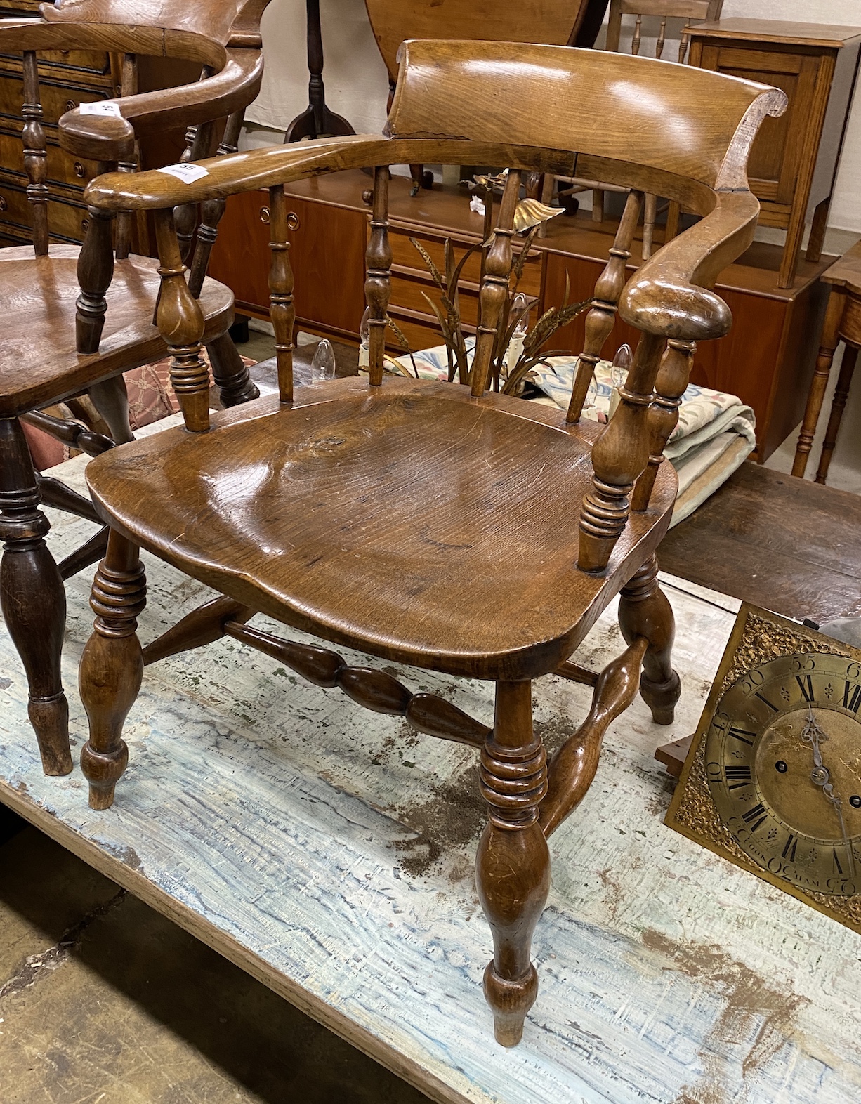 A Victorian elm and beech smoker's bow elbow chair, width 63cm, depth 52cm, height 78cm                                                                                                                                     