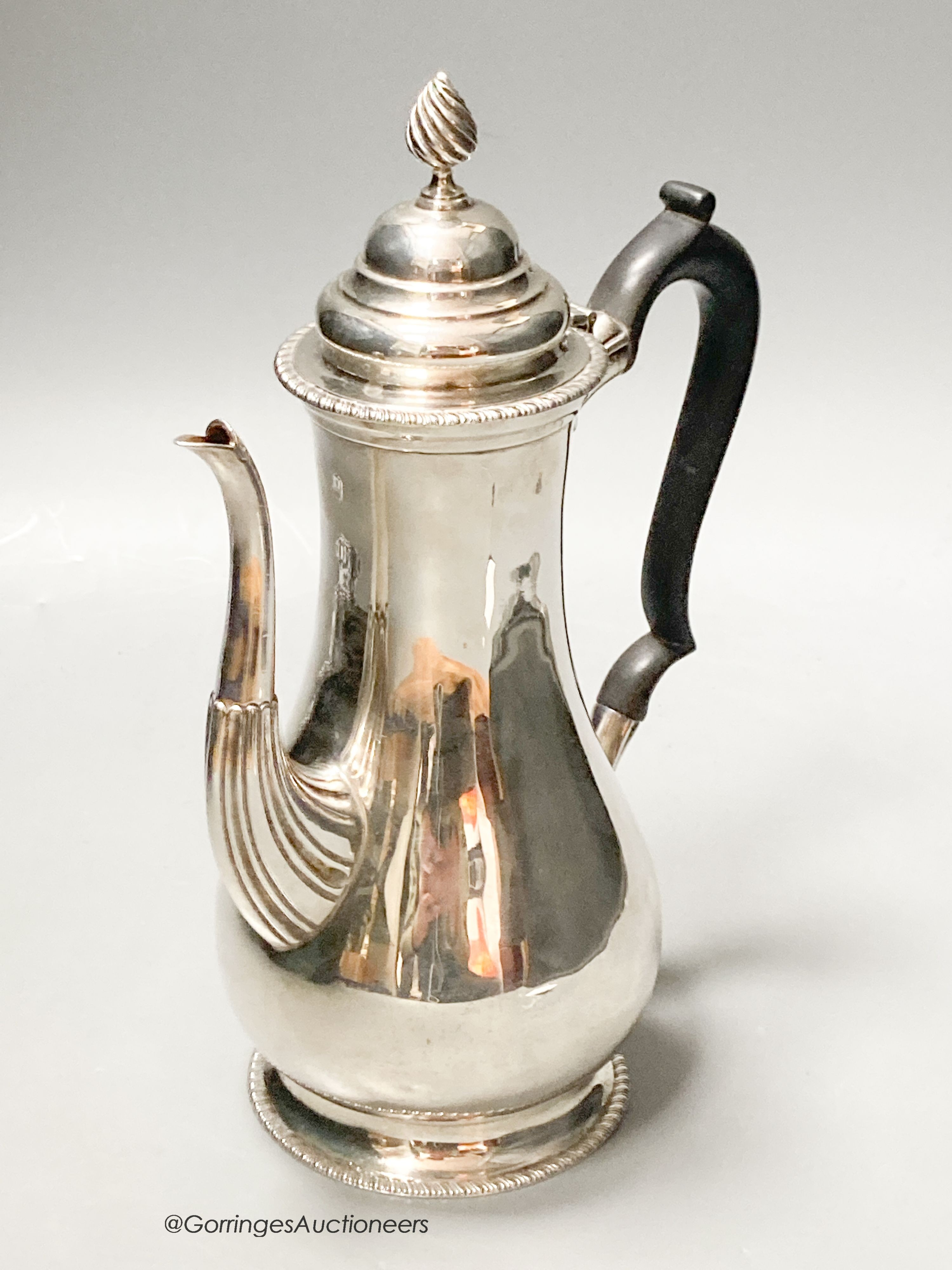 A George V silver baluster coffee pot, Carrington & Co, London, 1927, height 26cm, 20.5oz.                                                                                                                                  