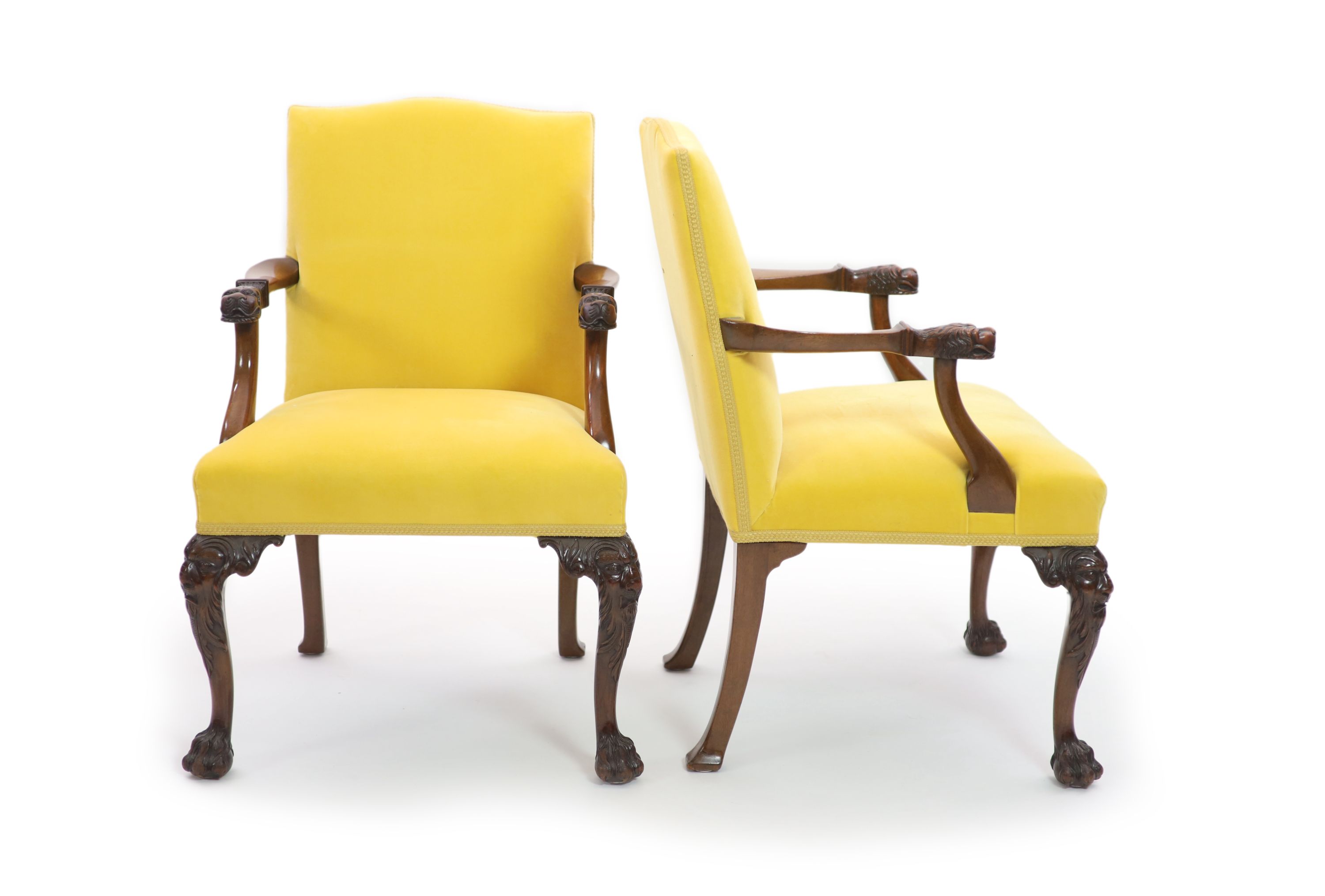 A pair of George II style mahogany elbow chairs, W.60cm D.60cm H.91cm                                                                                                                                                       