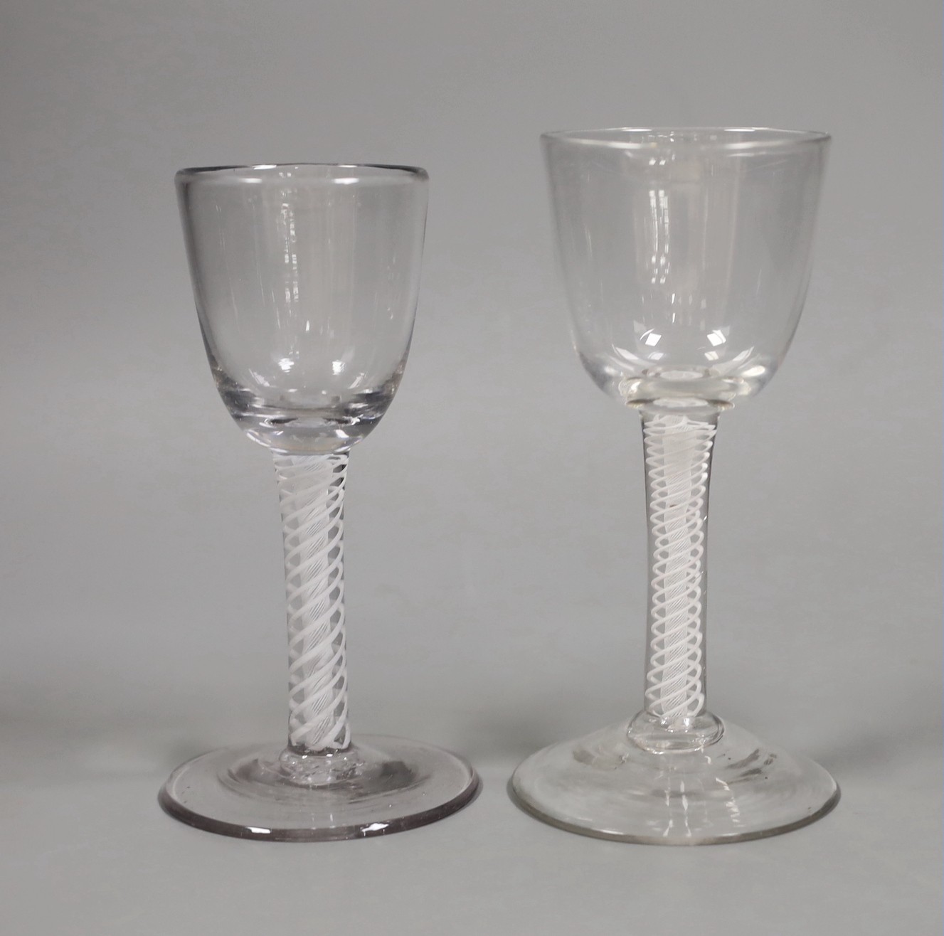 Two 18th century double series opaque twist stem glasses, tallest 15cm                                                                                                                                                      