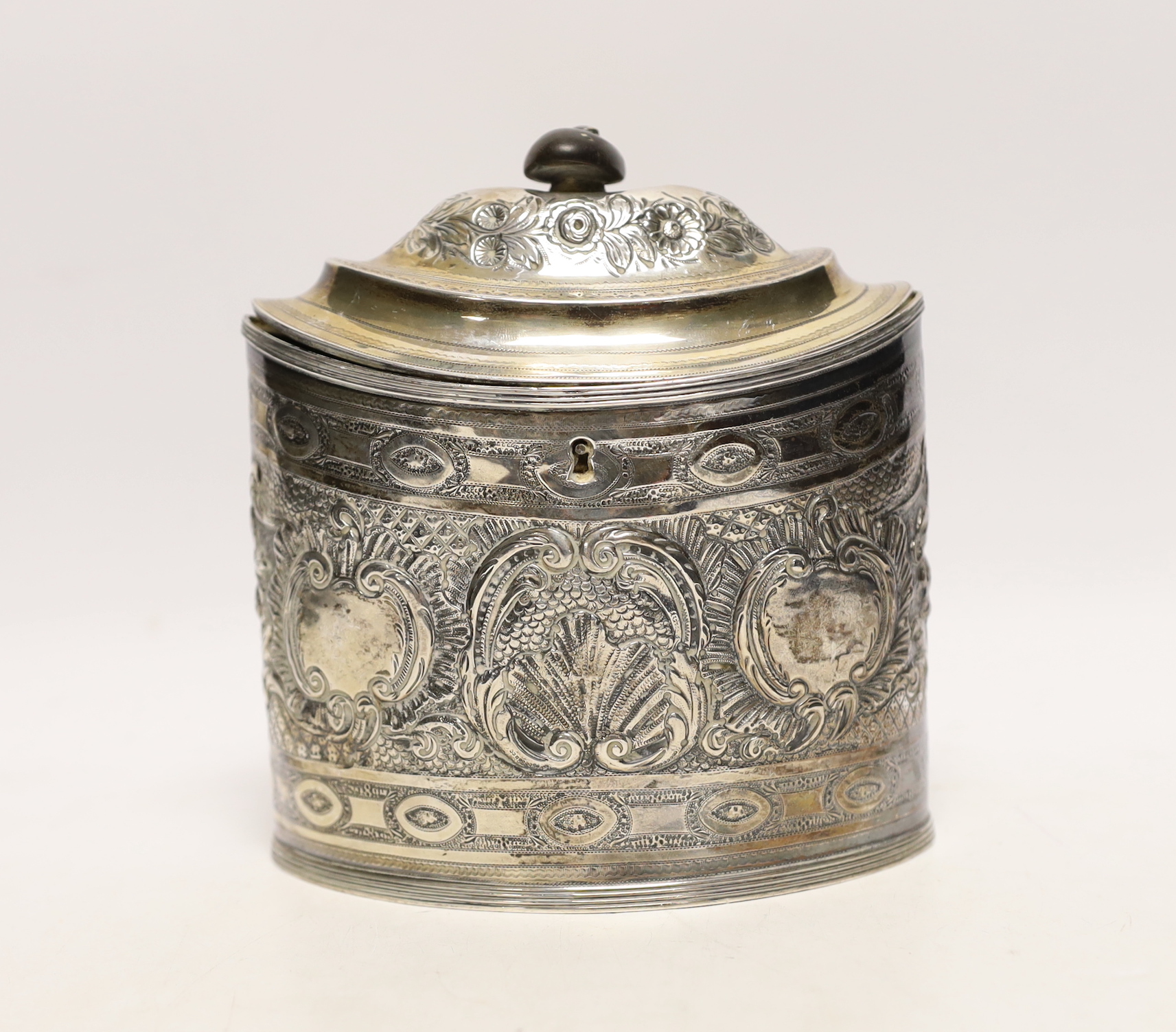 A George III silver oval tea caddy, with later embossed decoration, Peter & Ann Bateman, London, 1796, height 15.2cm, gross weight 11.2oz.                                                                                  