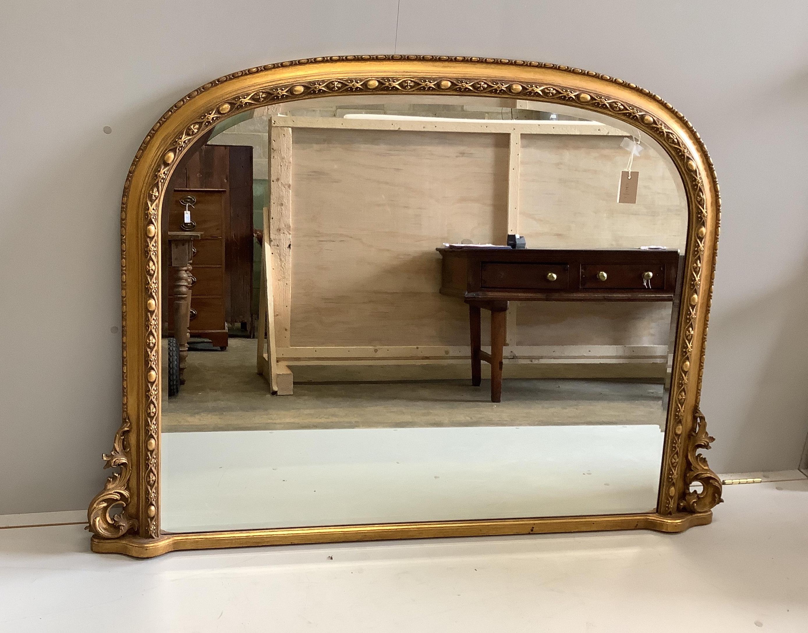 A Victorian style gilt framed overmantel mirror, width 145cm, height 107cm                                                                                                                                                  