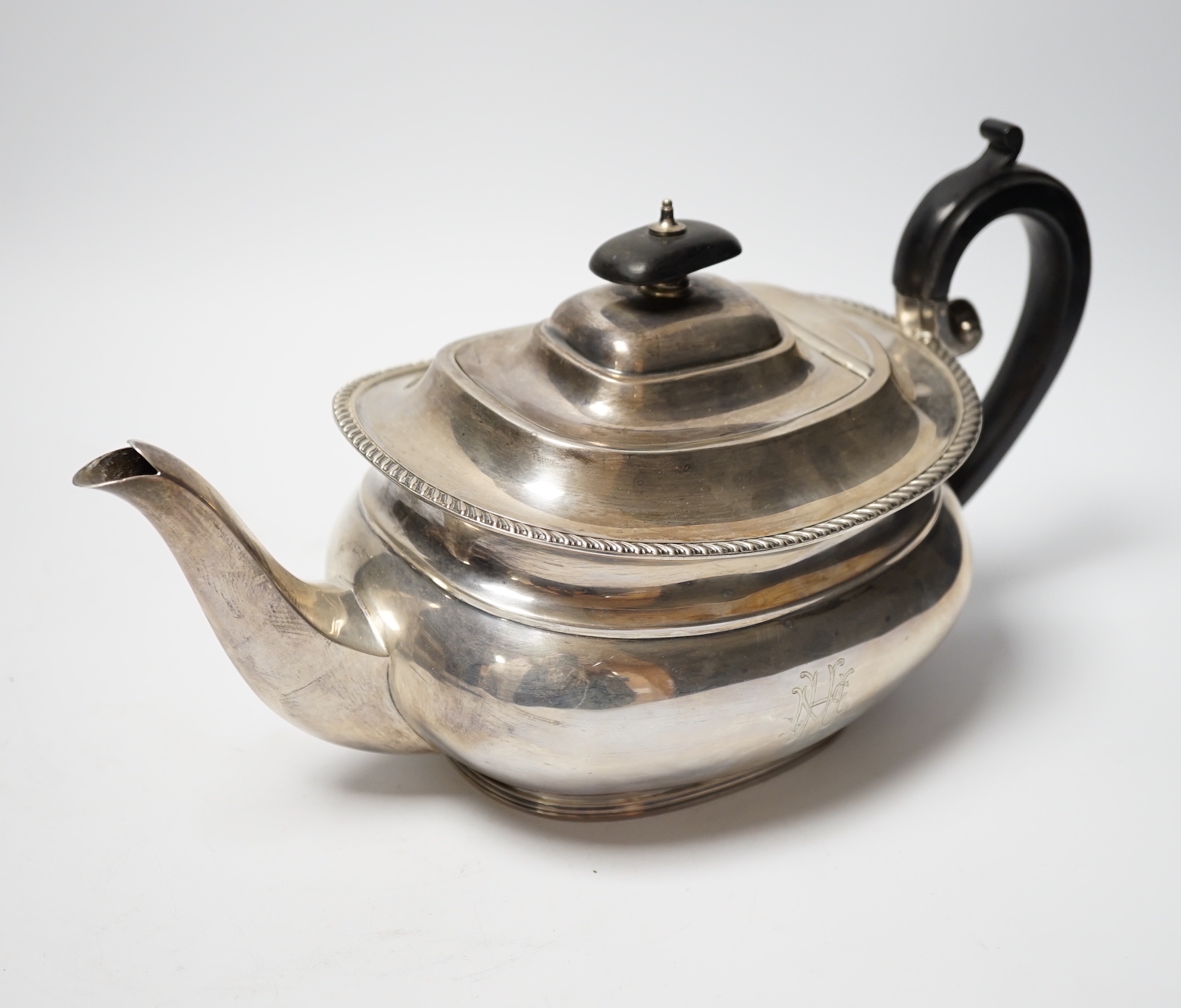 A George V silver teapot by Sebastian Garrard, London, 1927, gross weight 20.9oz.                                                                                                                                           