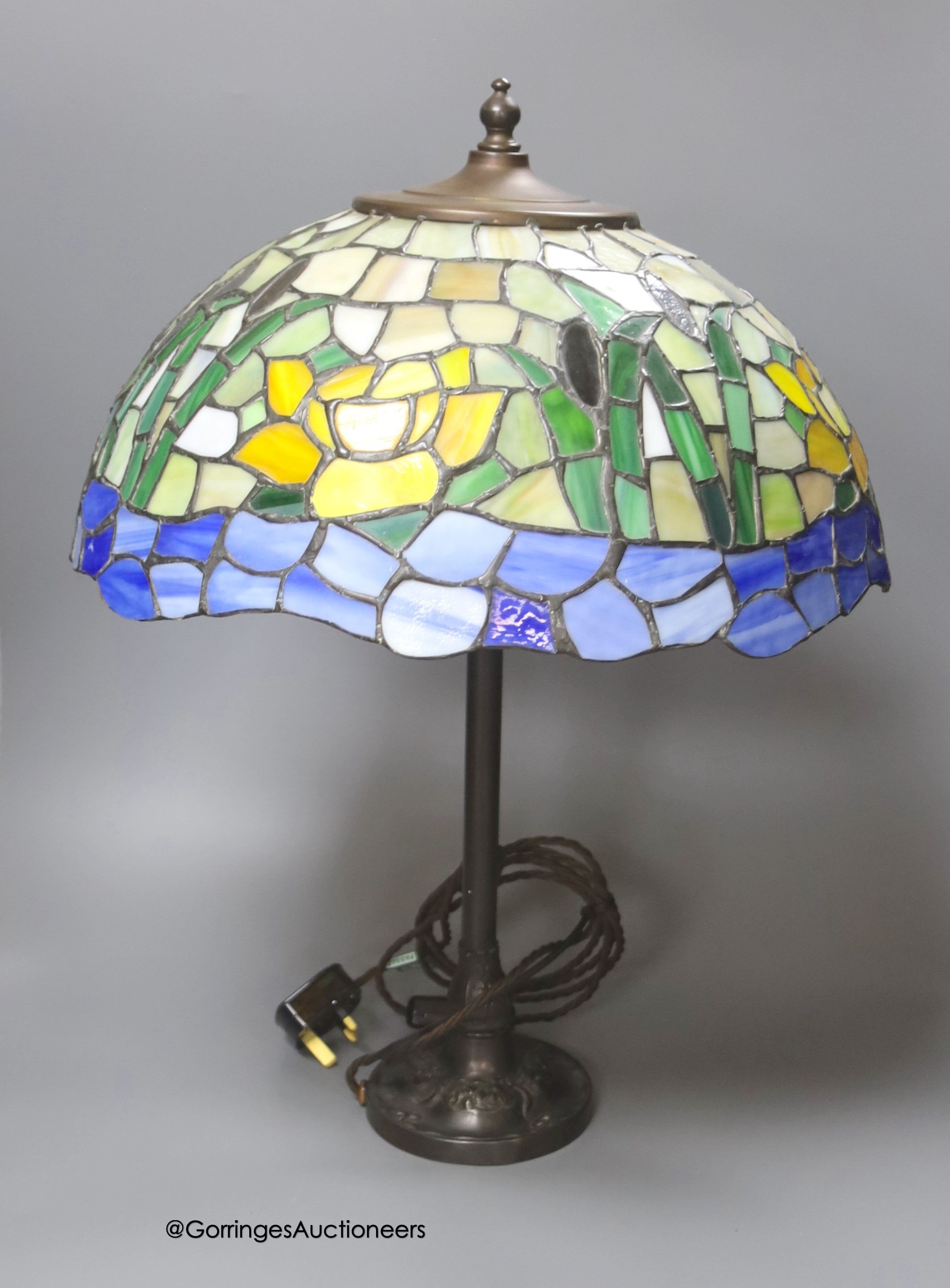 A Tiffany style lamp and shade, base marked RD427117, height 54cm                                                                                                                                                           