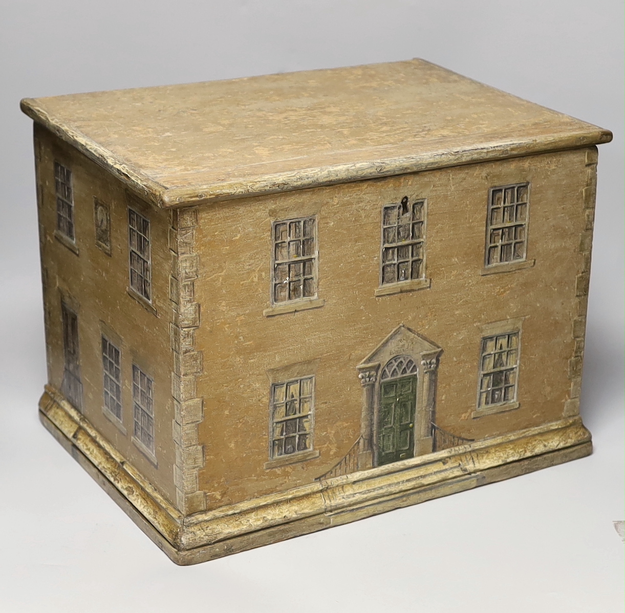 A 19th century pine box overpainted as an earlier Georgian house, painted on three sides, 42cm x 31cm high                                                                                                                  