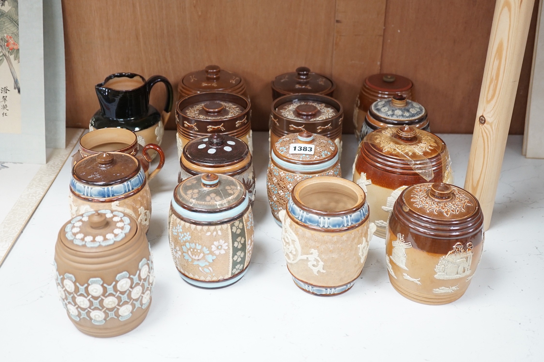 A quantity of Doulton stoneware tobacco jars and jugs                                                                                                                                                                       