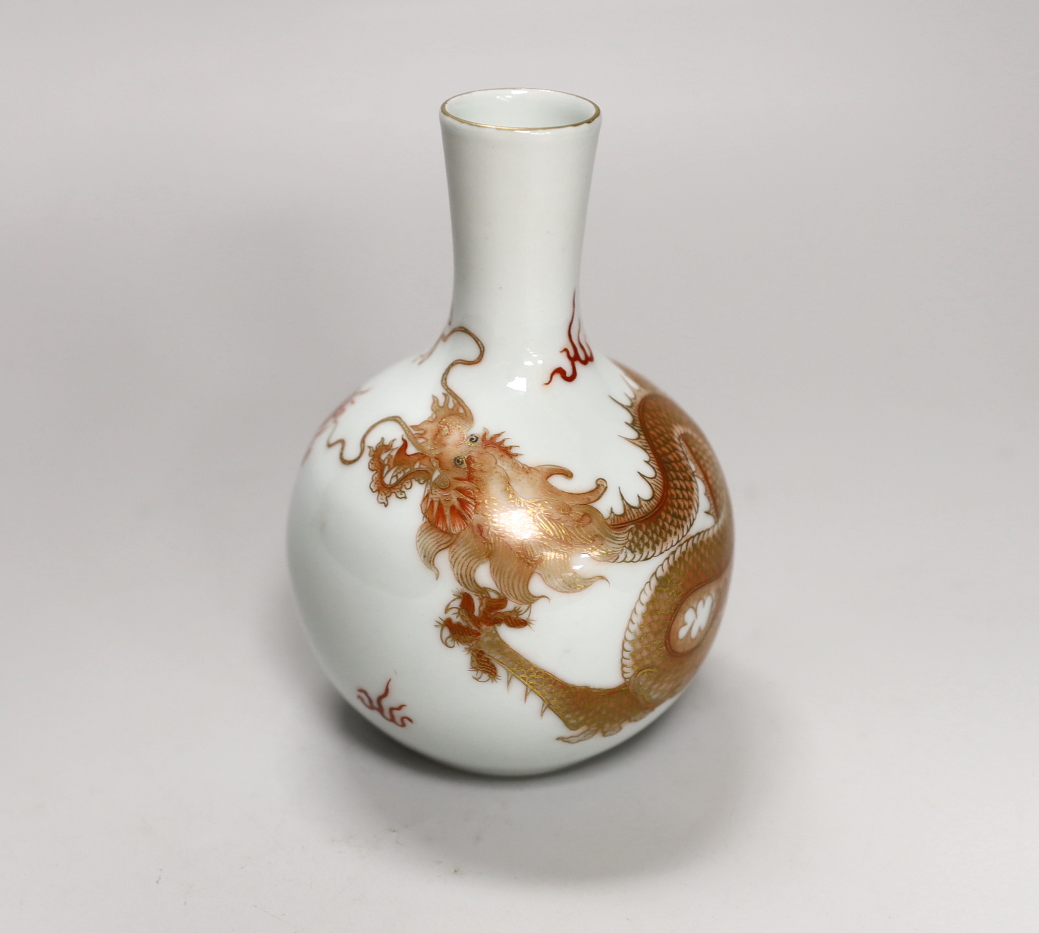 A Chinese rouge de fer decorated ‘dragon’ bottle vase, 14cm high (boxed)                                                                                                                                                    
