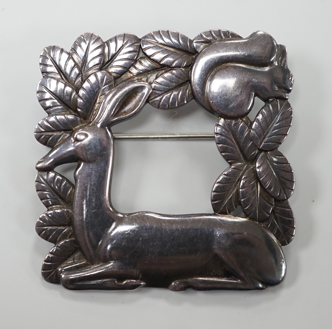 A 1960's Georg Jensen sterling 925 deer and squirrel square brooch, design no. 318, 40mm, with Jensen box.                                                                                                                  