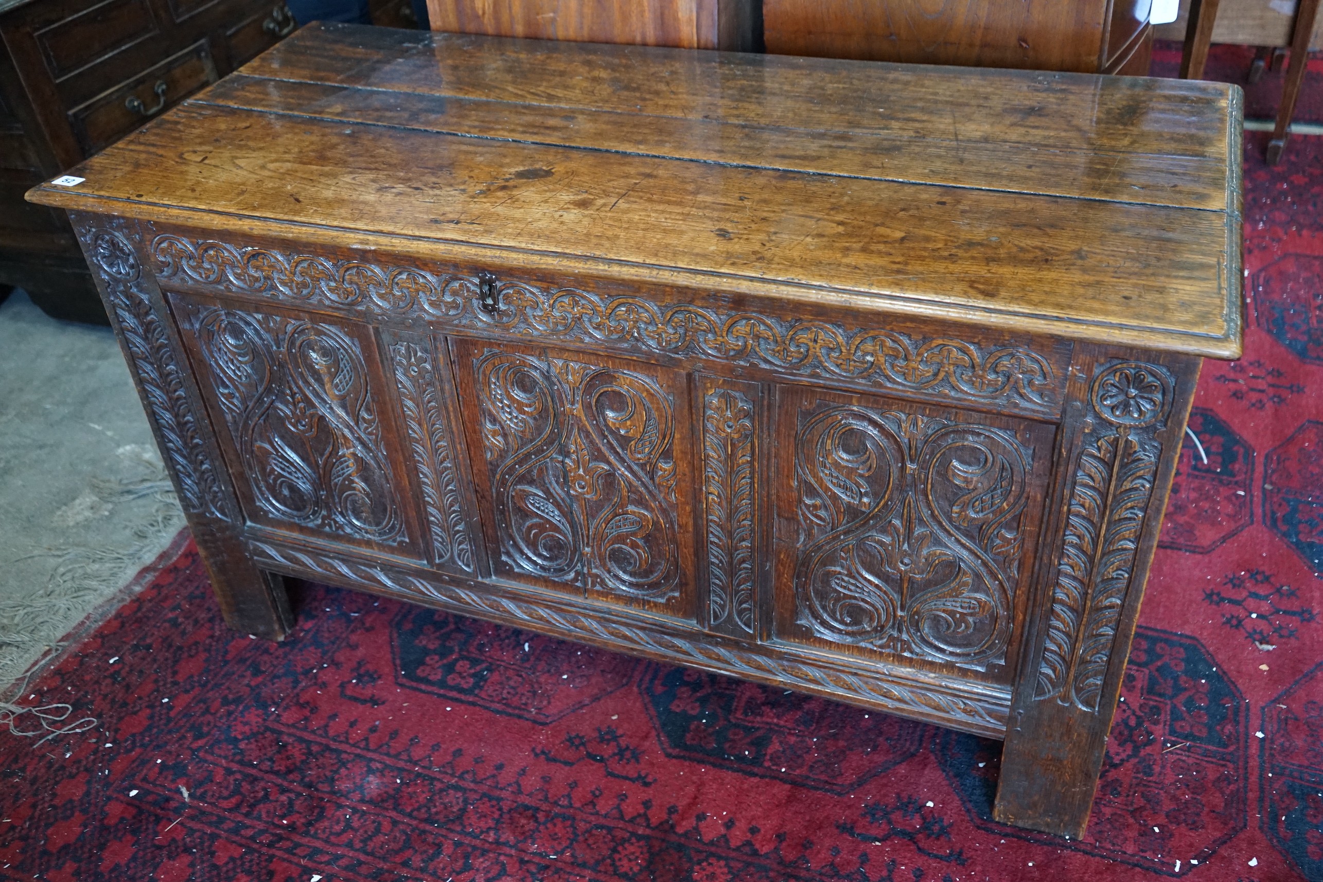 A late 17th /early 18th century carved oak panelled coffer, length 128cm, depth 58cm, height 72cm                                                                                                                           