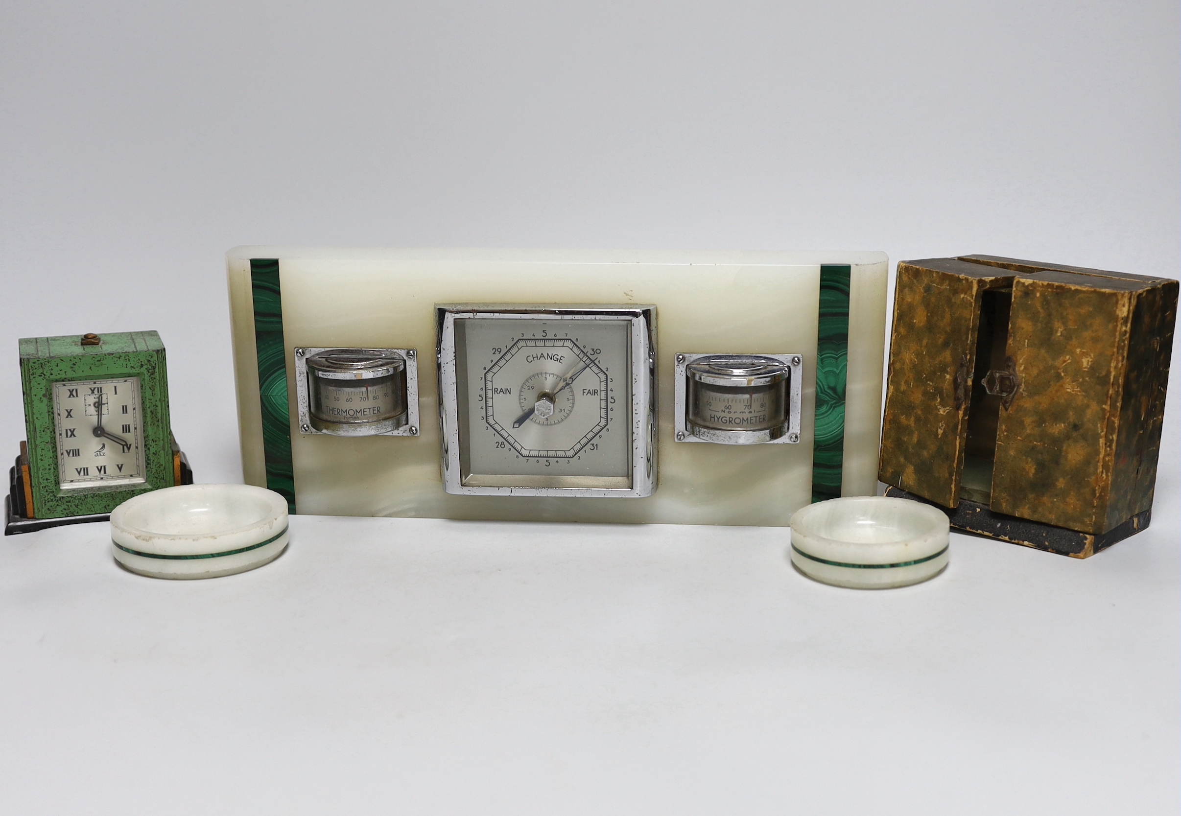 An Art Deco white onyx and malachite desk-top barometer, pair of matching dishes, together with a Jaz alarm clock in fitted case, the largest, 30cm wide                                                                    